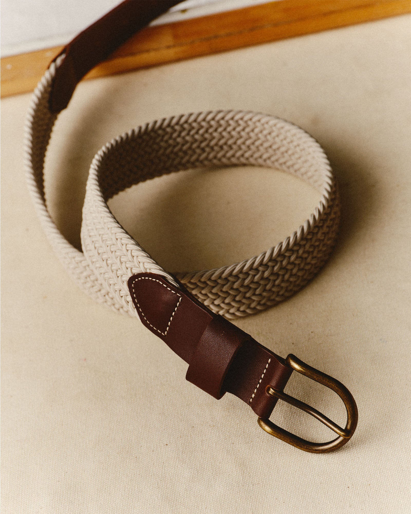 editorial image of the buckle on The Stretch Braided Belt in Natural, Accessories by Taylor Stitch