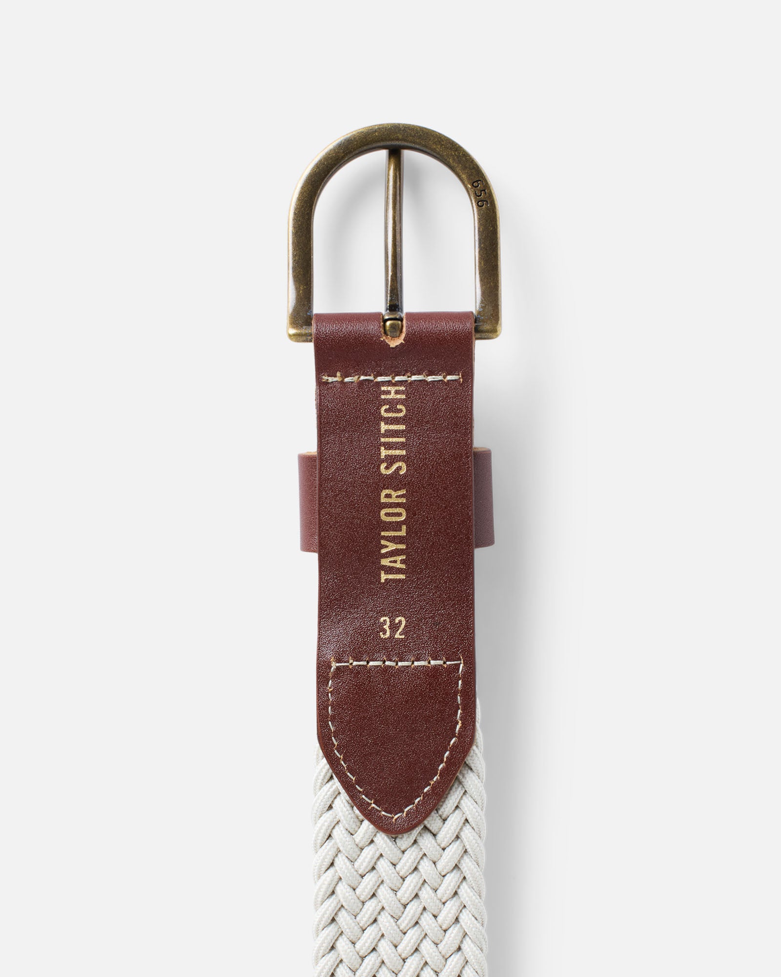 editorial image of the branding on The Stretch Braided Belt in Natural, Accessories by Taylor Stitch