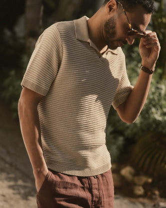 fit model posing in The Valencia Sweater Polo in Sand Stripe