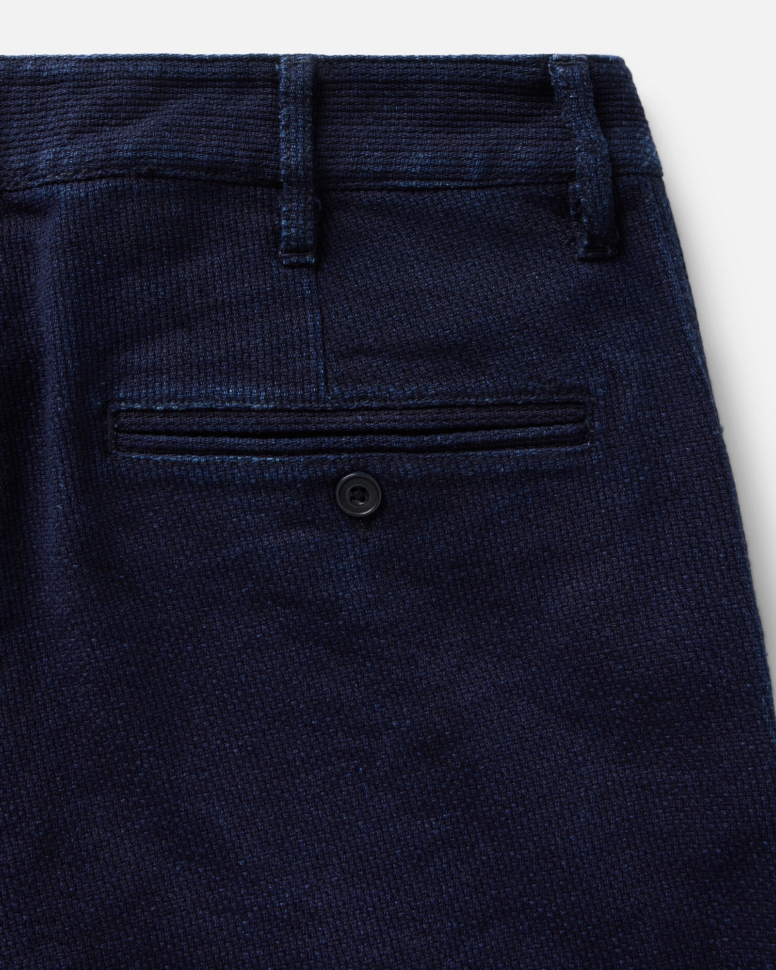 material shot of the back pocket on The Camden Pant in Rinsed Indigo Sashiko, Bottoms by Taylor Stitch