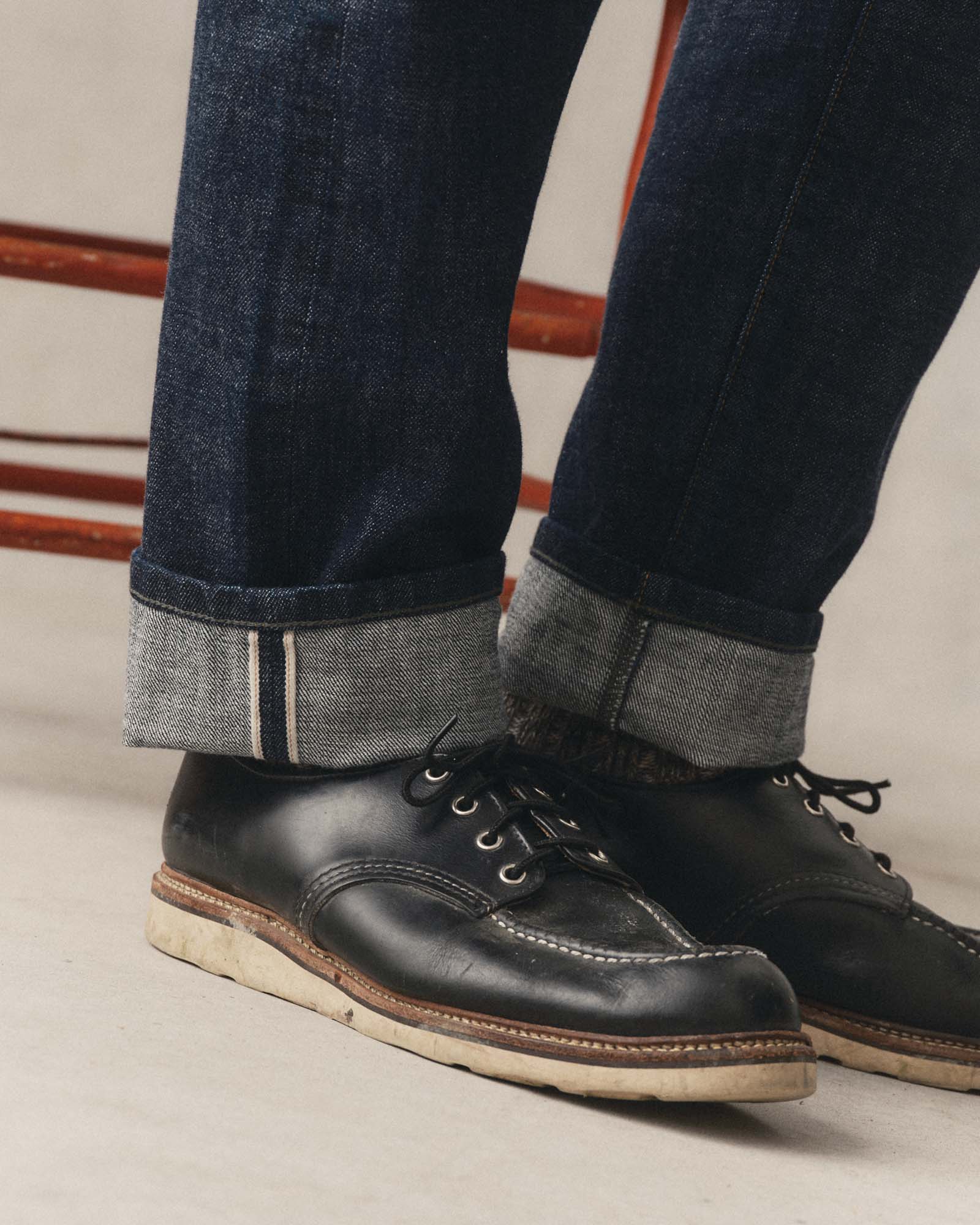 fit model showing off the cuff on The Democratic Jean in Rinsed Organic Selvedge, Bottoms by Taylor Stitch