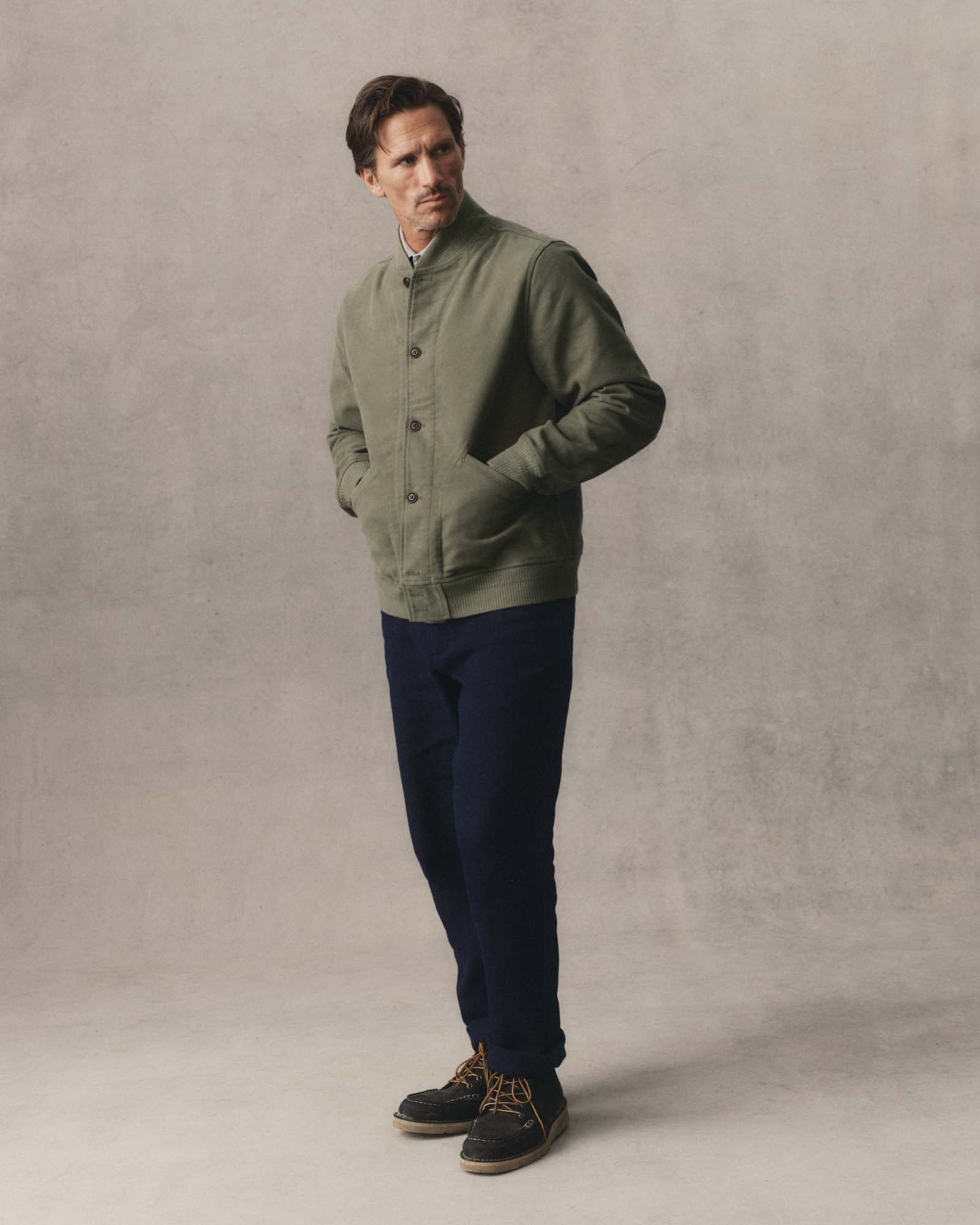 fit model with his hands in the pockets of The Clark Bomber in Smoked Olive Moleskin, Outerwear by Taylor Stitch