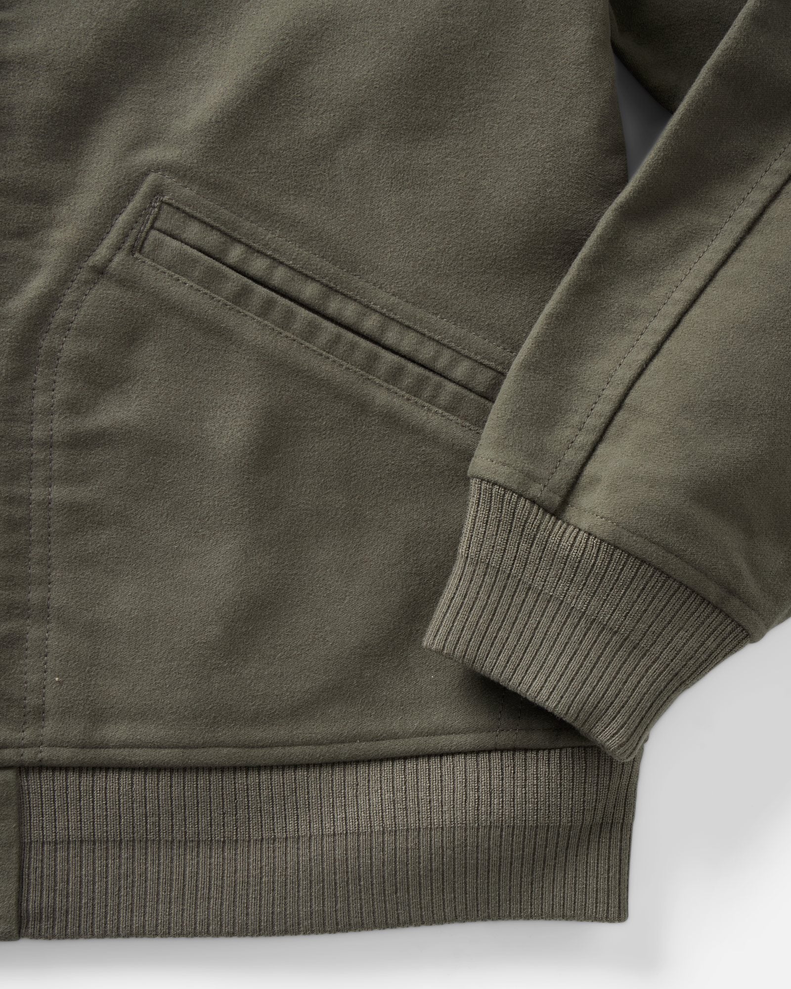 material shot of the sleeve on The Clark Bomber in Smoked Olive Moleskin, Outerwear by Taylor Stitch