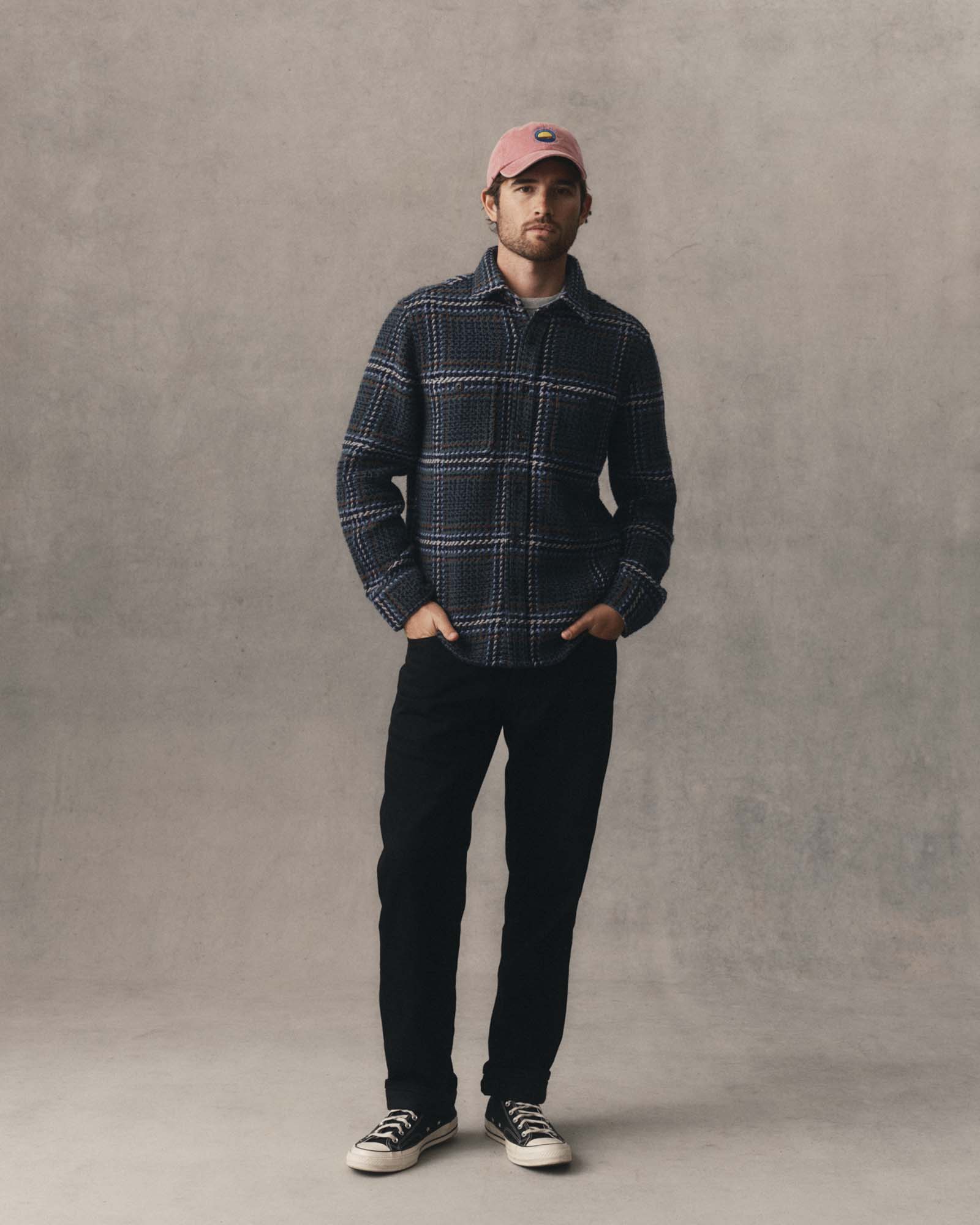 fit model posing in The Cutter Overshirt in Canal Check, Wovens by Taylor Stitch