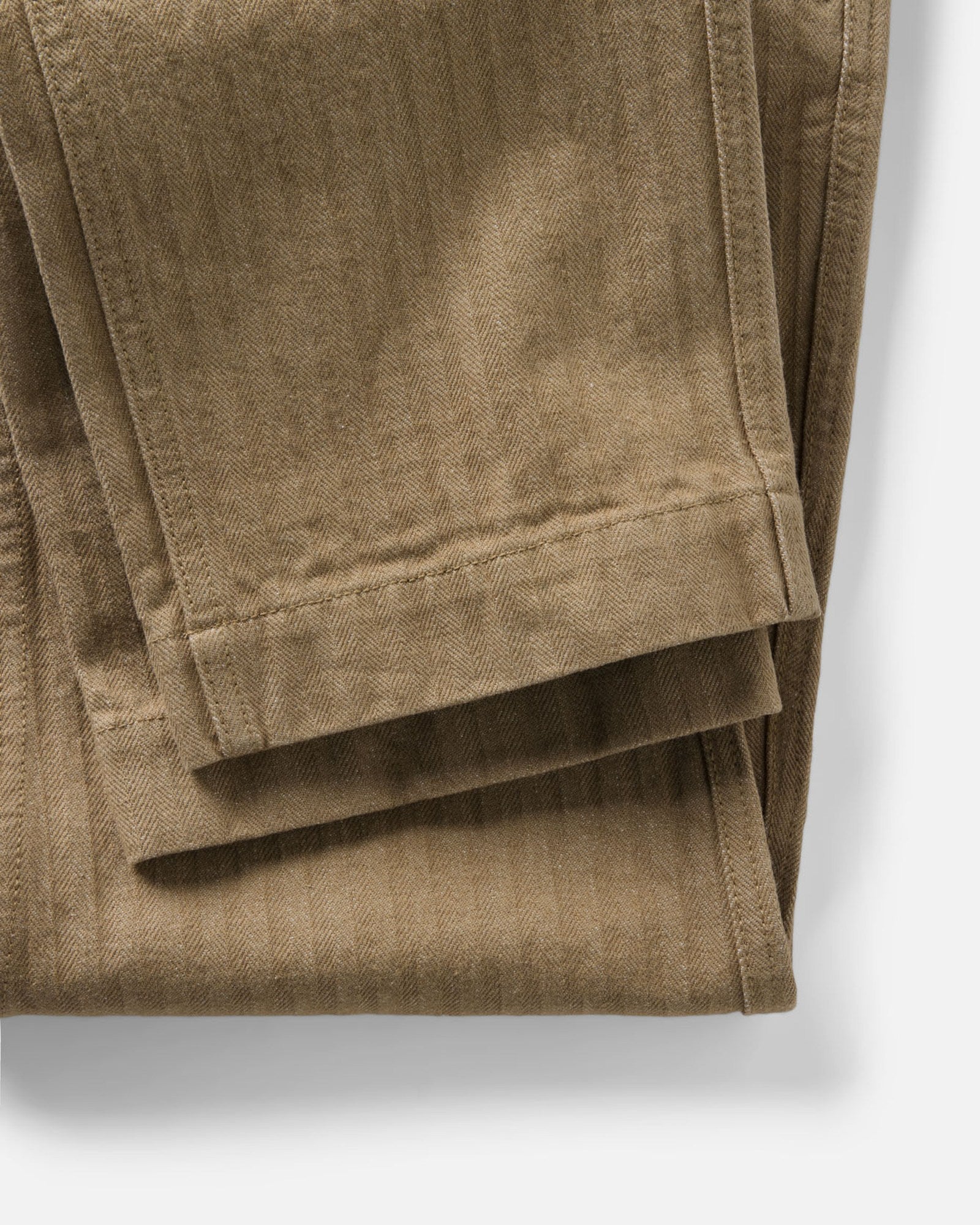 material shot of the hem on The Emlen Pant in Khaki Herringbone, Bottoms by Taylor Stitch