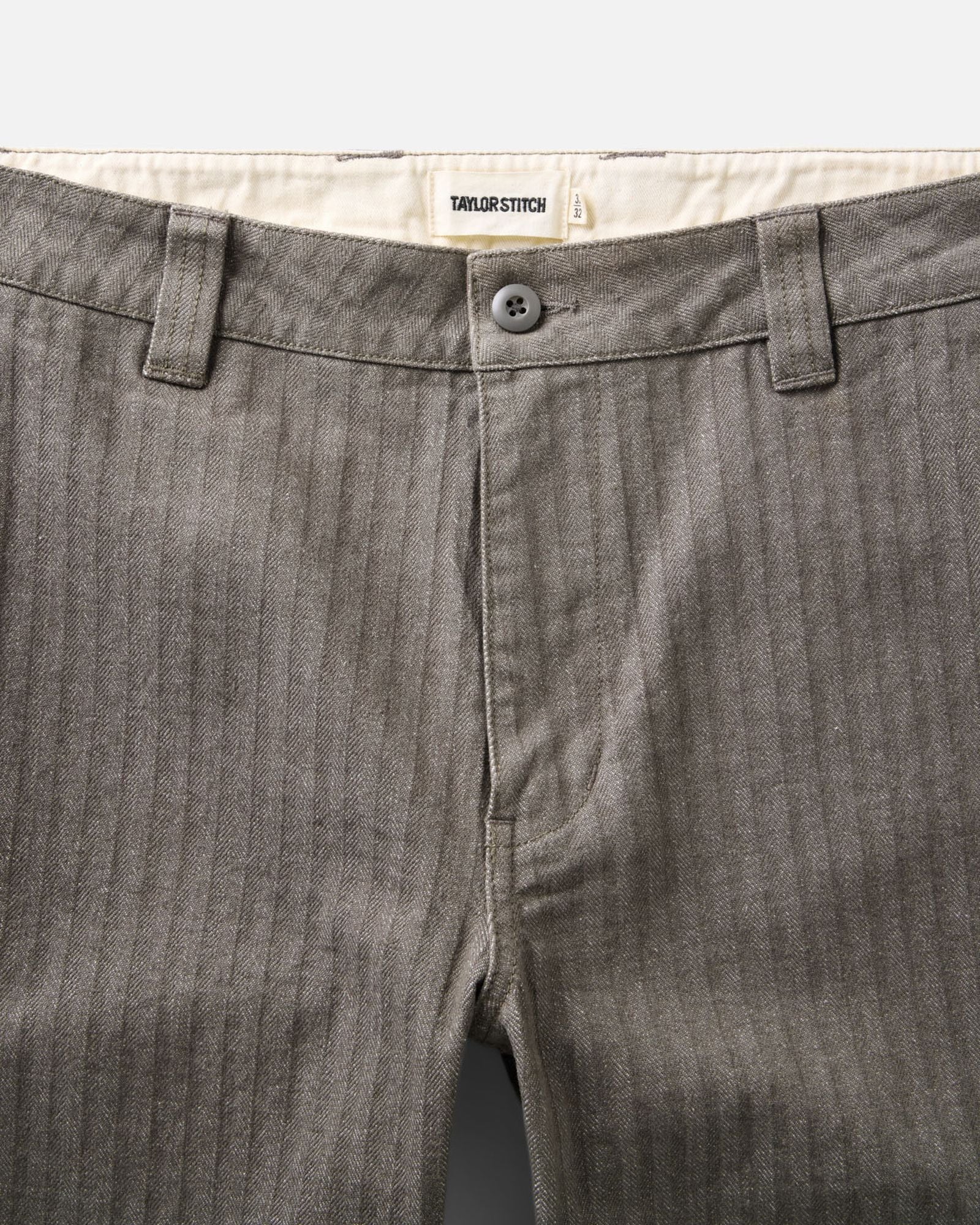 material shot of the waistband on The Emlen Pant in Smoked Olive Herringbone, Bottoms by Taylor Stitch