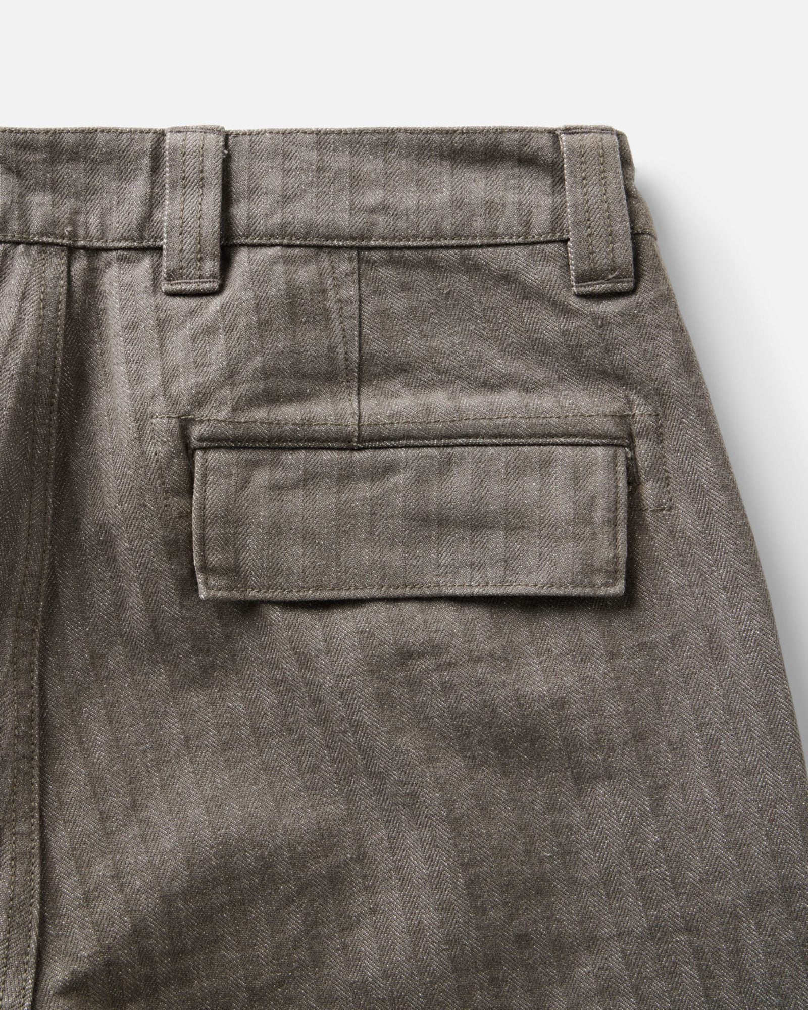 material shot of the back pocket on The Emlen Pant in Smoked Olive Herringbone, Bottoms by Taylor Stitch
