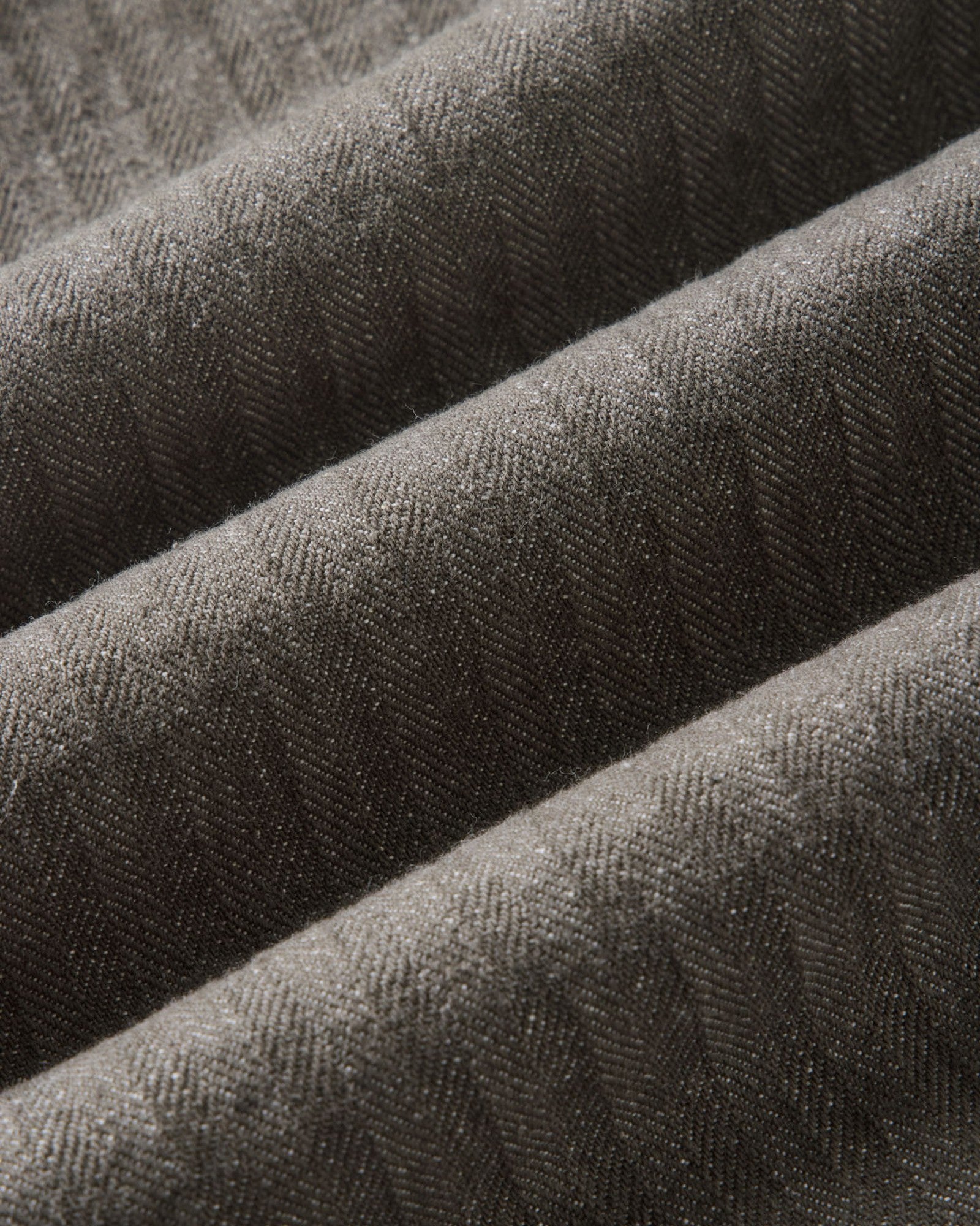 material shot of the fabric on The Emlen Pant in Smoked Olive Herringbone, Bottoms by Taylor Stitch