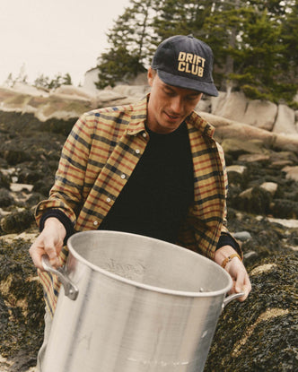 fit model holding a pot wearing The Jack in Marsh Check Oxford