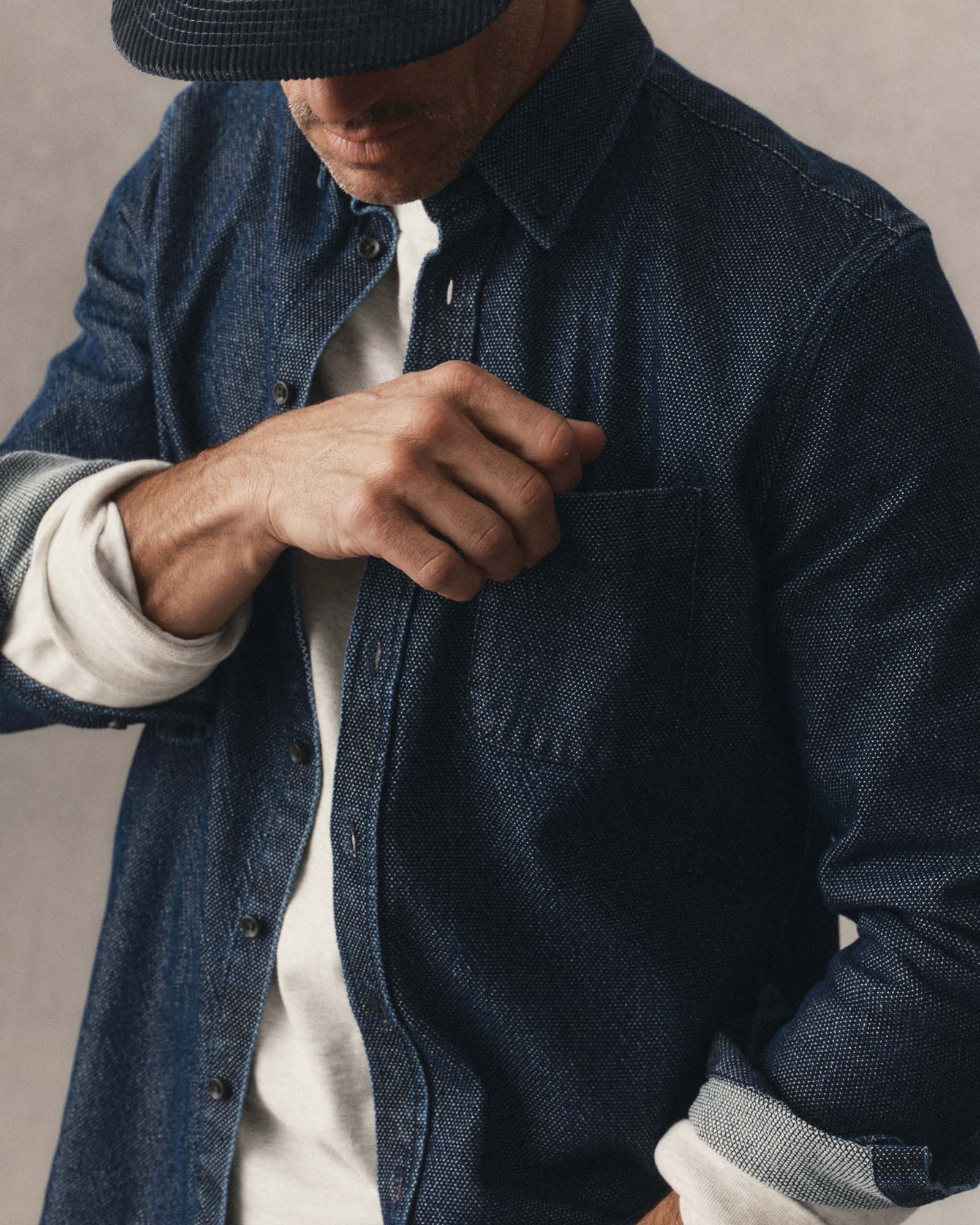 fit model showing off the pocket on The Jack in Rinsed Indigo Japanese Jacquard Dot, Wovens by Taylor Stitch