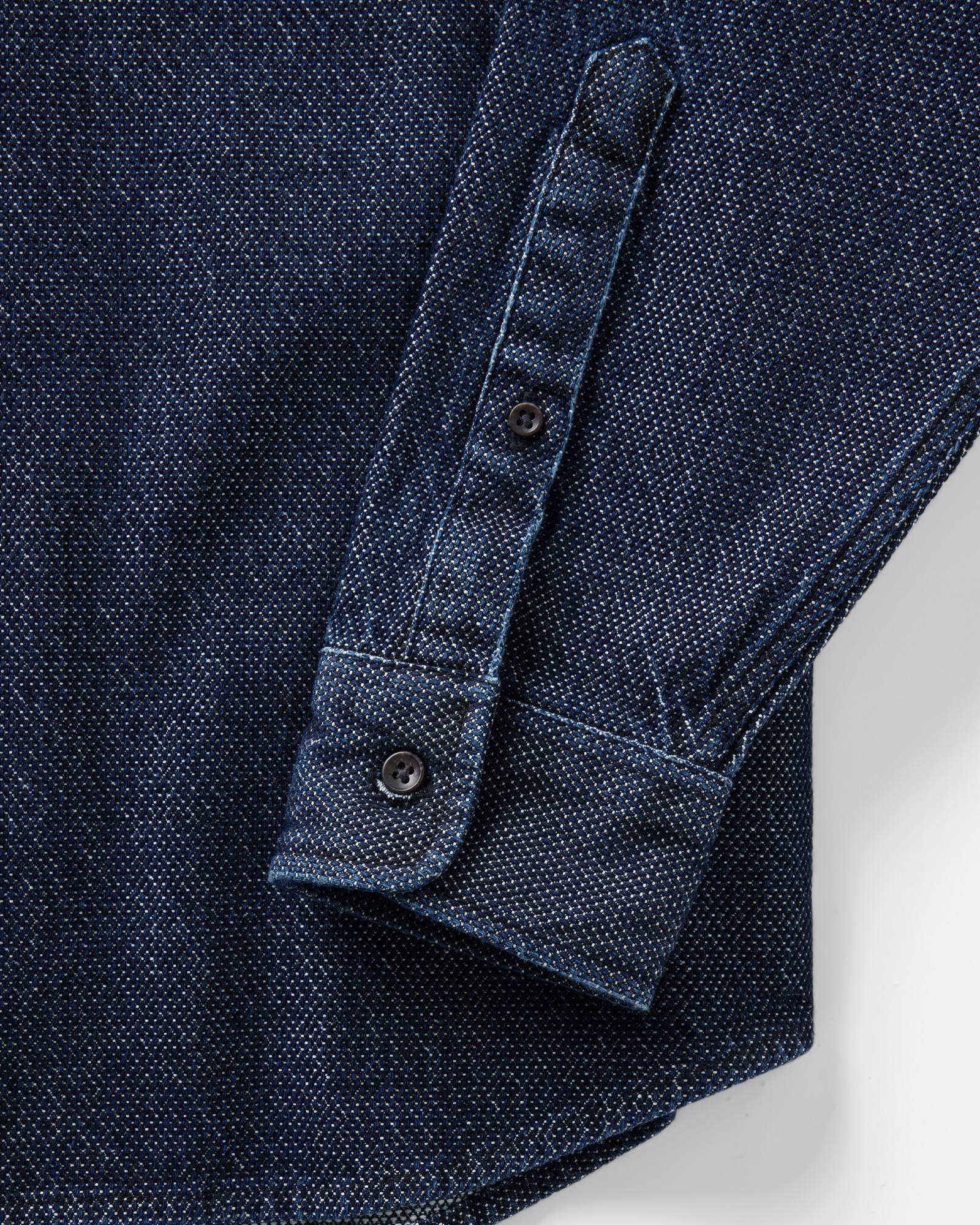 material shot of the sleeve on The Jack in Rinsed Indigo Japanese Jacquard Dot, Wovens by Taylor Stitch