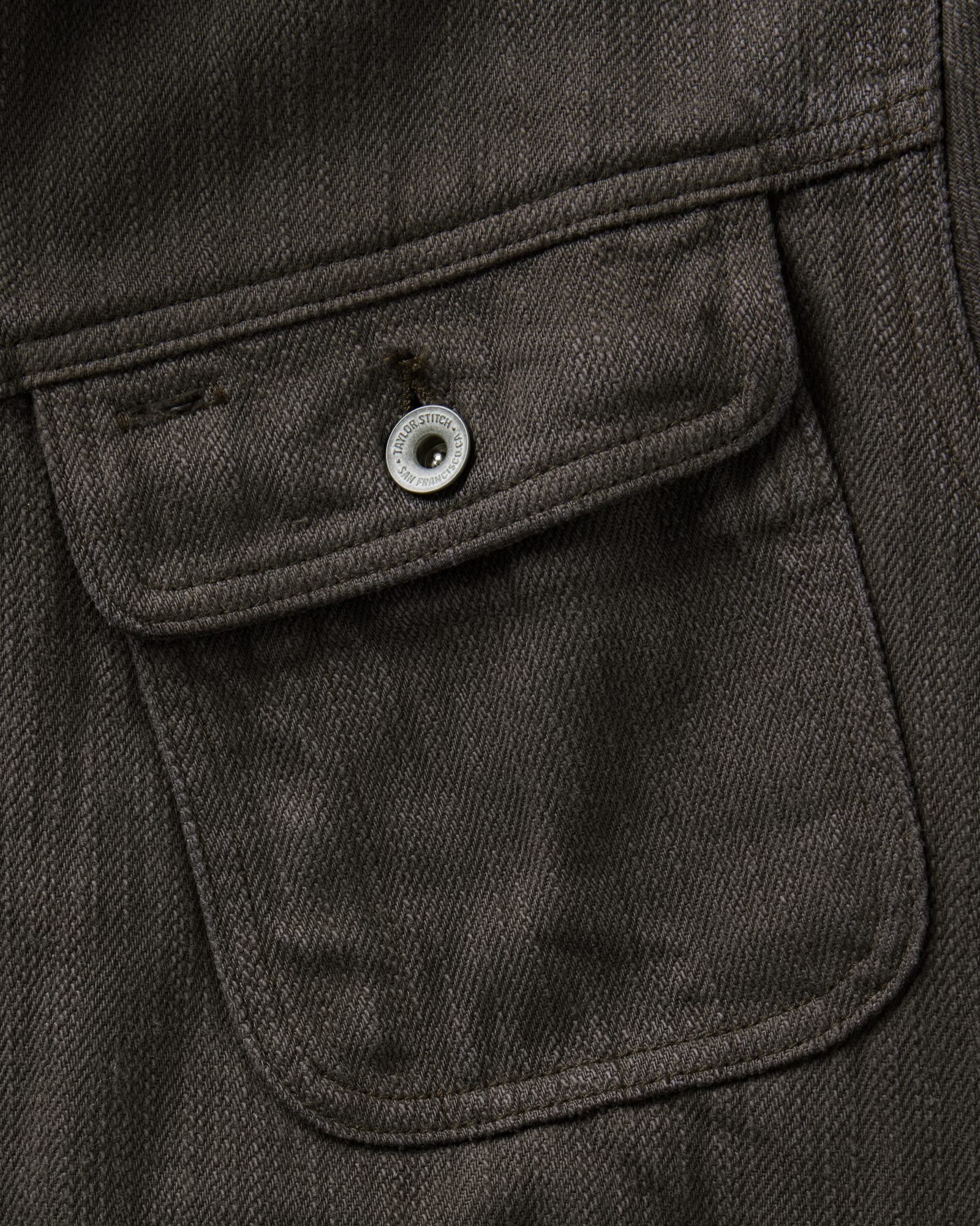 material shot of the pocket on The Long Haul Jacket in Soil Slub Denim, Outerwear by Taylor Stitch
