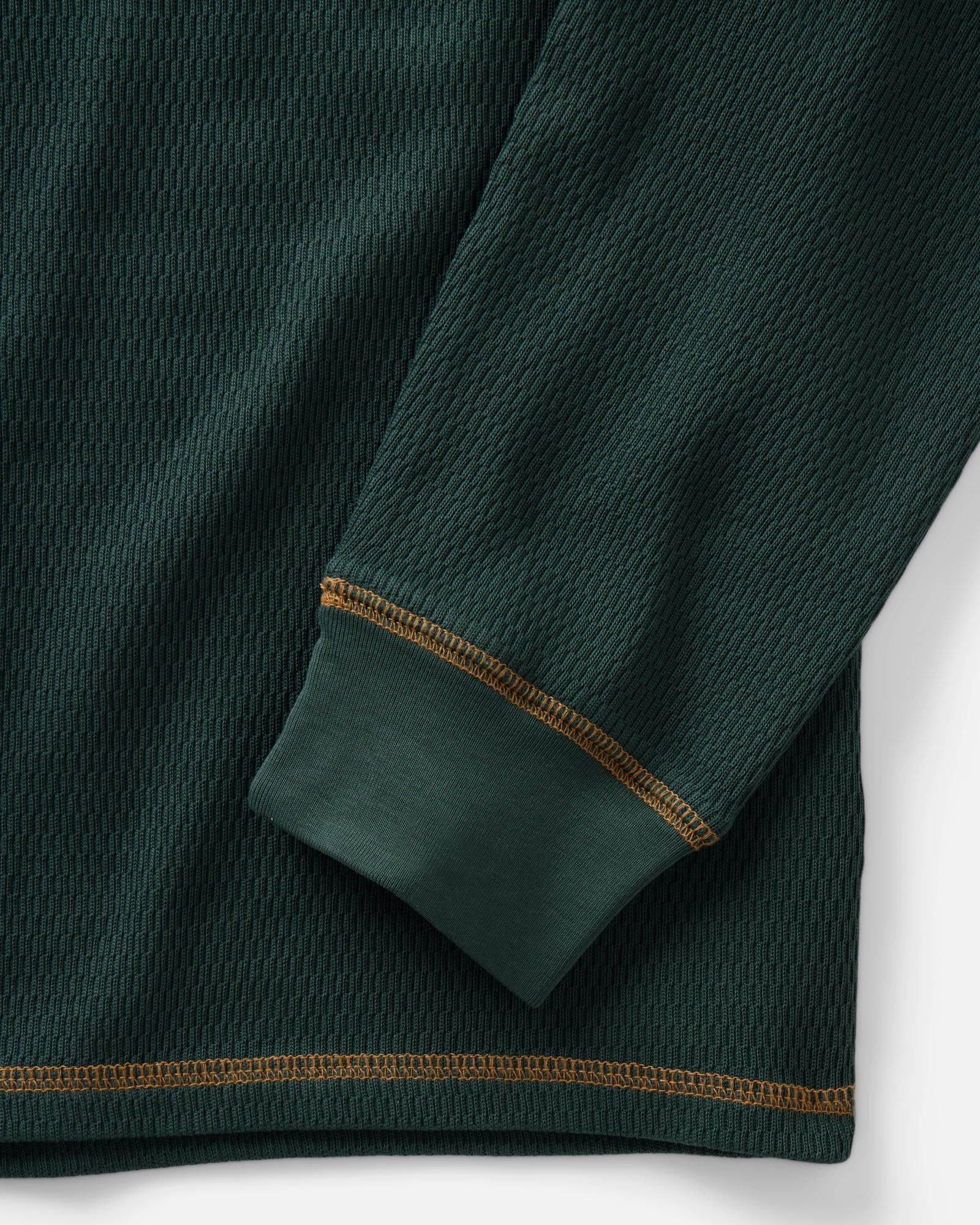 material shot of the sleeve on The Organic Cotton Crew in Dark Forest Waffle, Knits by Taylor Stitch