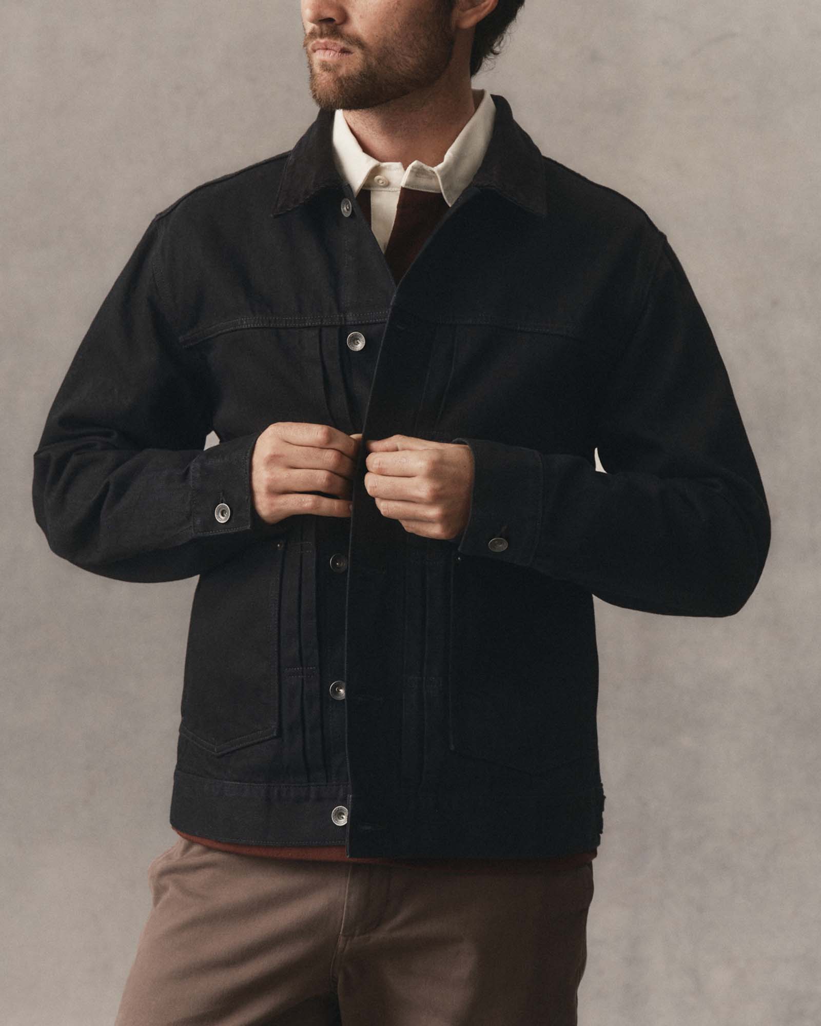 fit model showing off the buttons on The Ryder Jacket in Rinsed Black Organic Selvedge, Outerwear by Taylor Stitch