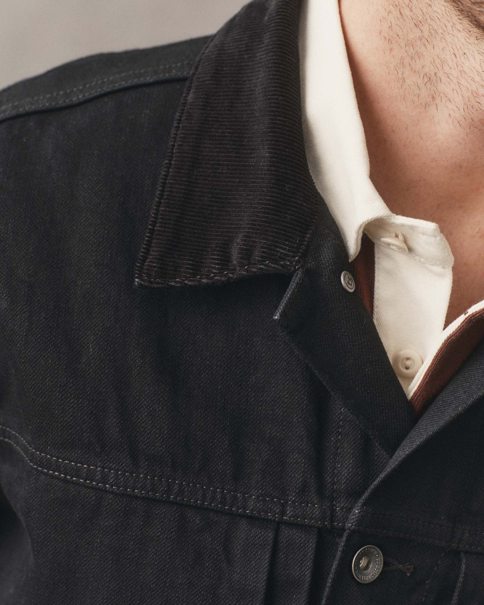 fit model showing off the collar on The Ryder Jacket in Rinsed Black Organic Selvedge, Outerwear by Taylor Stitch