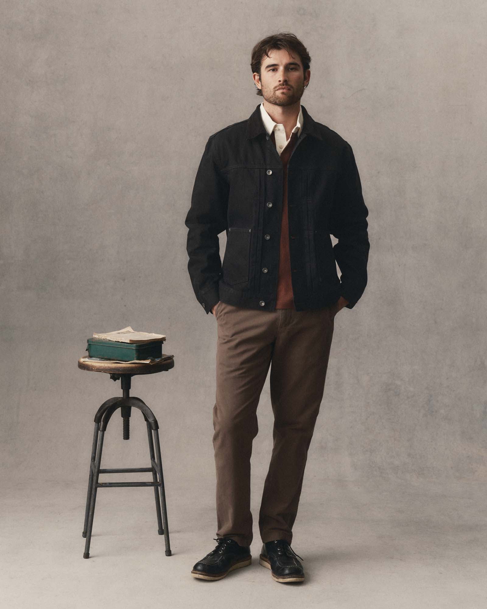 fit model posing in The Ryder Jacket in Rinsed Black Organic Selvedge, Outerwear by Taylor Stitch