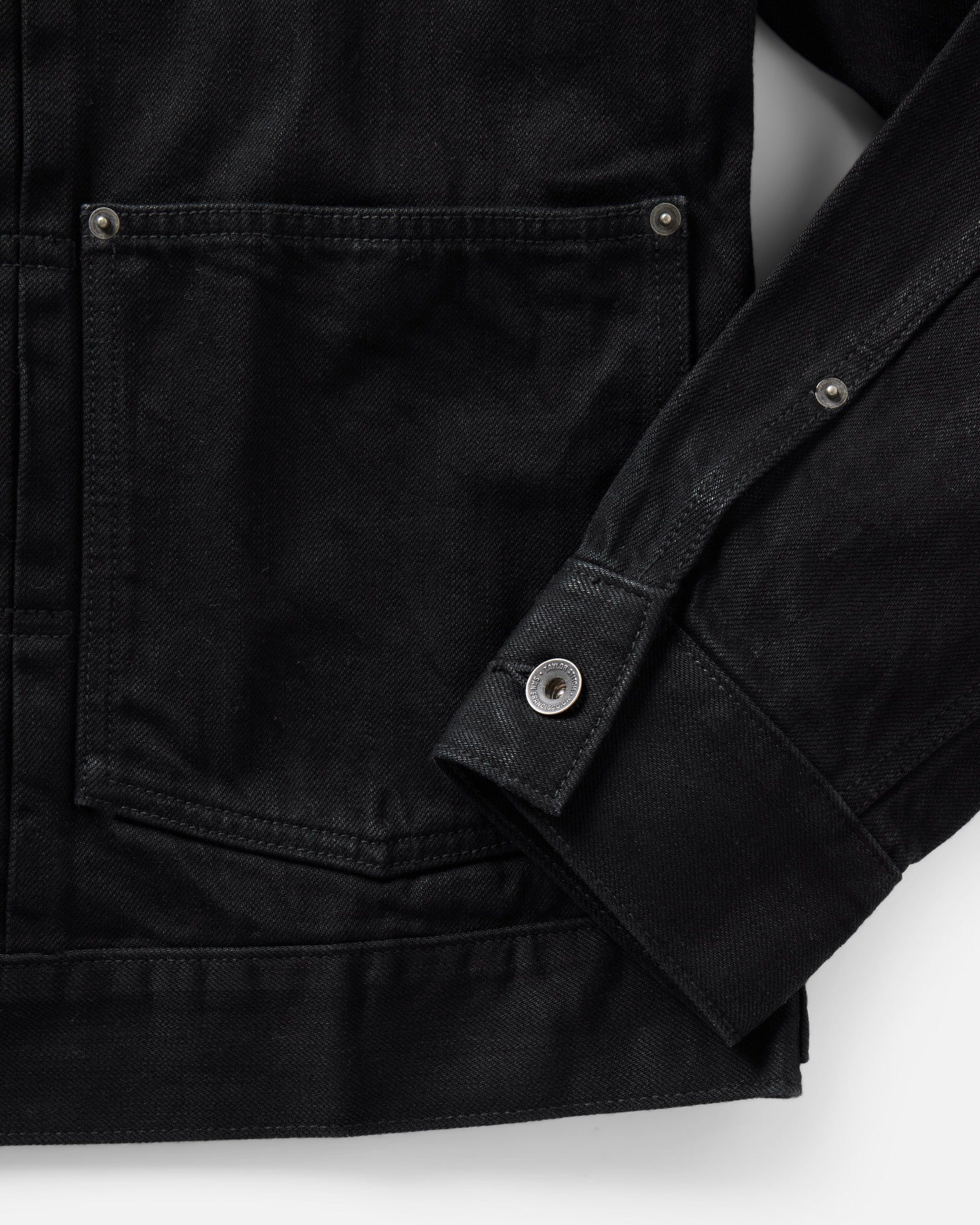 material shot of the sleeve on The Ryder Jacket in Rinsed Black Organic Selvedge, Outerwear by Taylor Stitch
