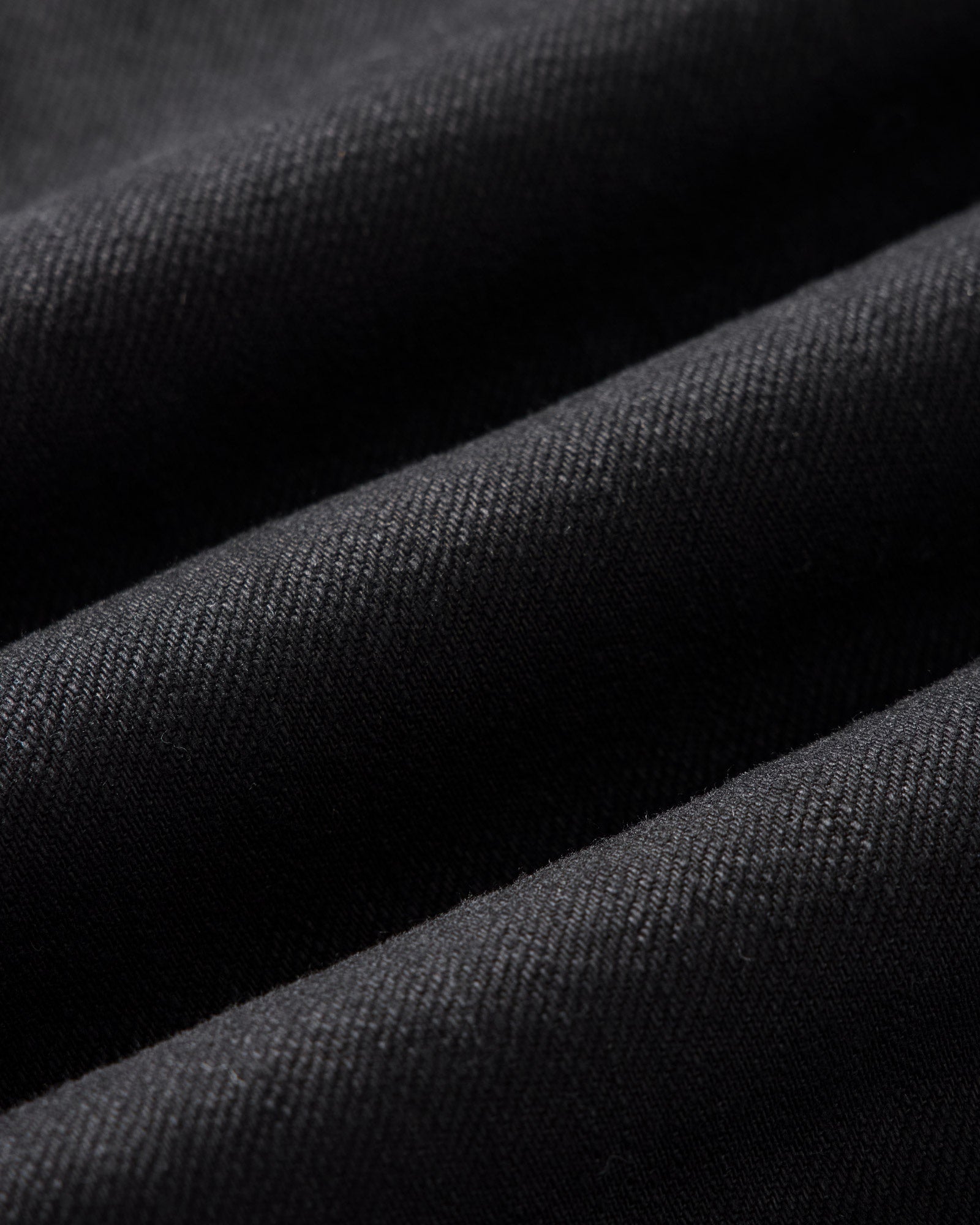 material shot of the fabric on The Ryder Jacket in Rinsed Black Organic Selvedge, Outerwear by Taylor Stitch