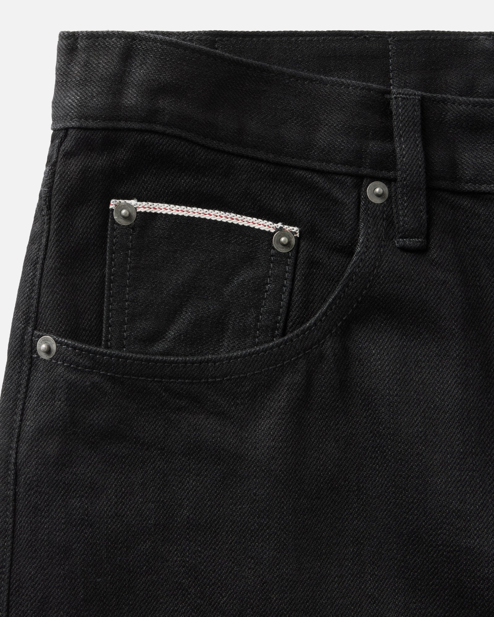material shot of the pocket on The Straight Jean in Rinsed Black Organic Selvedge, Bottoms by Taylor Stitch