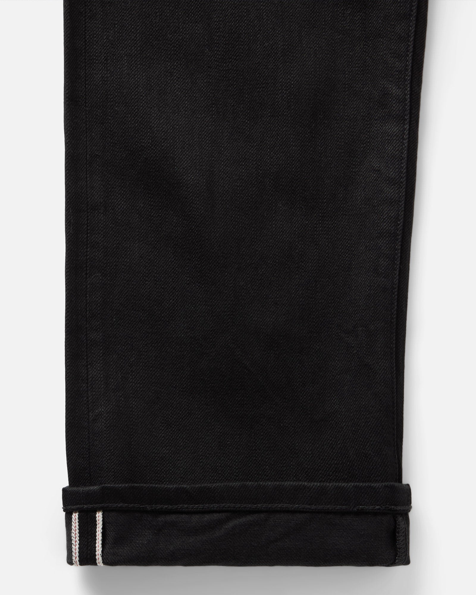 material shot of the cuff on The Straight Jean in Rinsed Black Organic Selvedge, Bottoms by Taylor Stitch