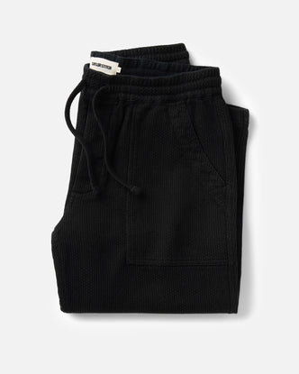 folded flatlay of The Breakwater Pant in Black Indigo Sashiko