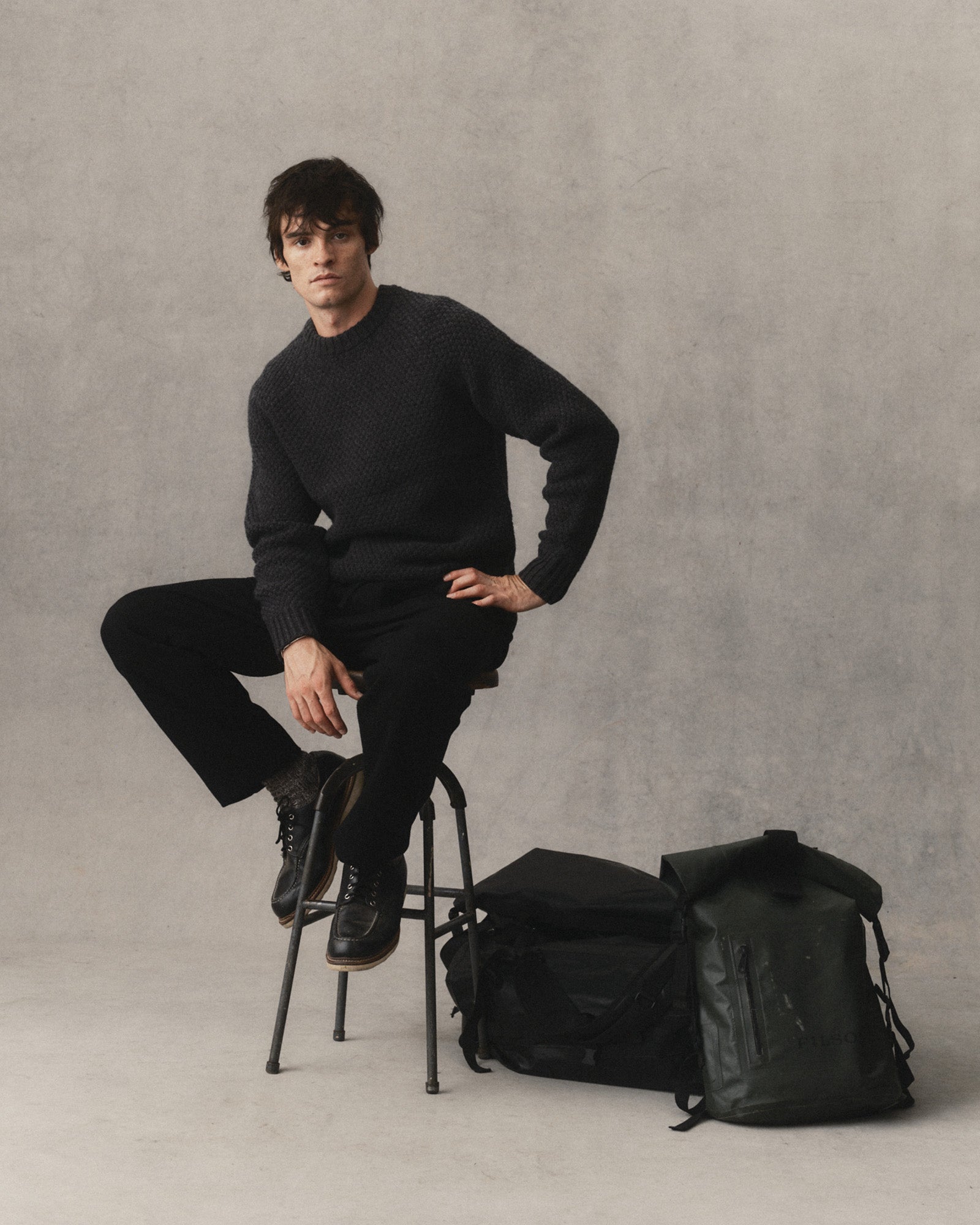 fit model sitting wearing The Breakwater Pant in Black Indigo Sashiko, Bottoms by Taylor Stitch