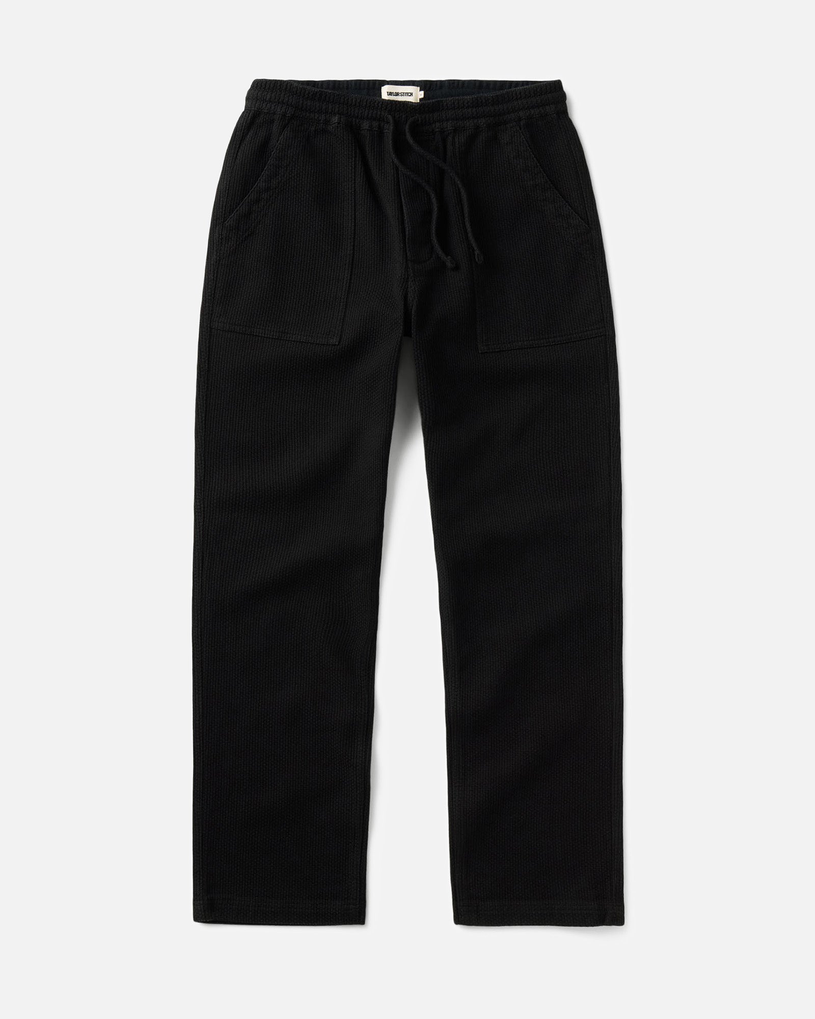 flatlay of The Breakwater Pant in Black Indigo Sashiko, Bottoms by Taylor Stitch
