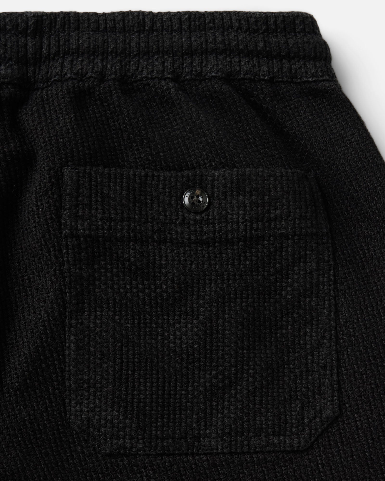 material shot of the back pocket on The Breakwater Pant in Black Indigo Sashiko, Bottoms by Taylor Stitch