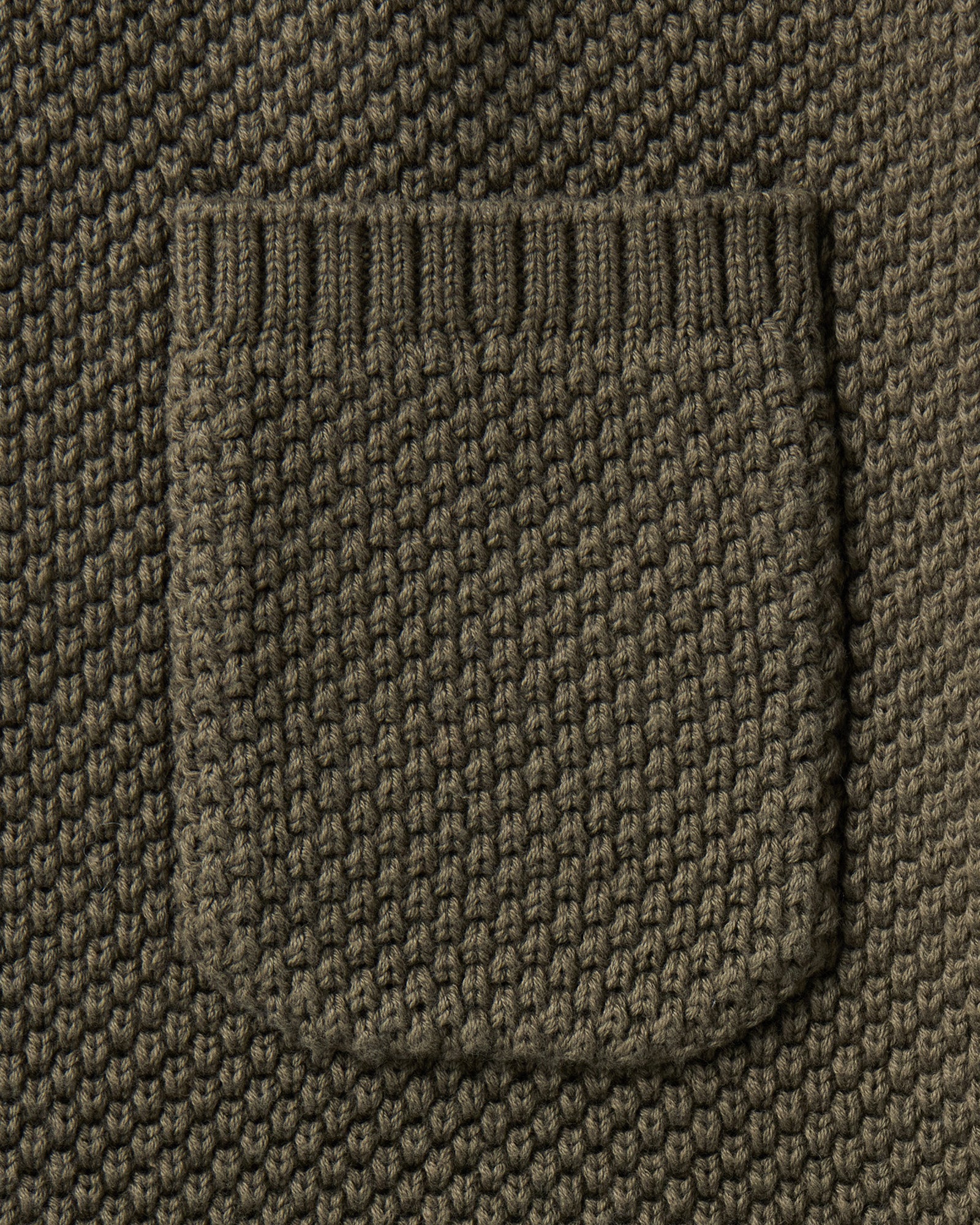 material shot of the pocket on The Crawford Crew Sweater in Fatigue Olive, Sweaters by Taylor Stitch