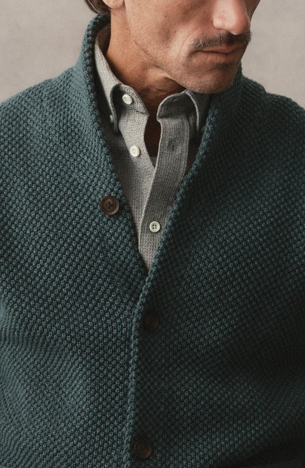 fit model showing off the button on The Crawford Sweater in Dark Forest Twist