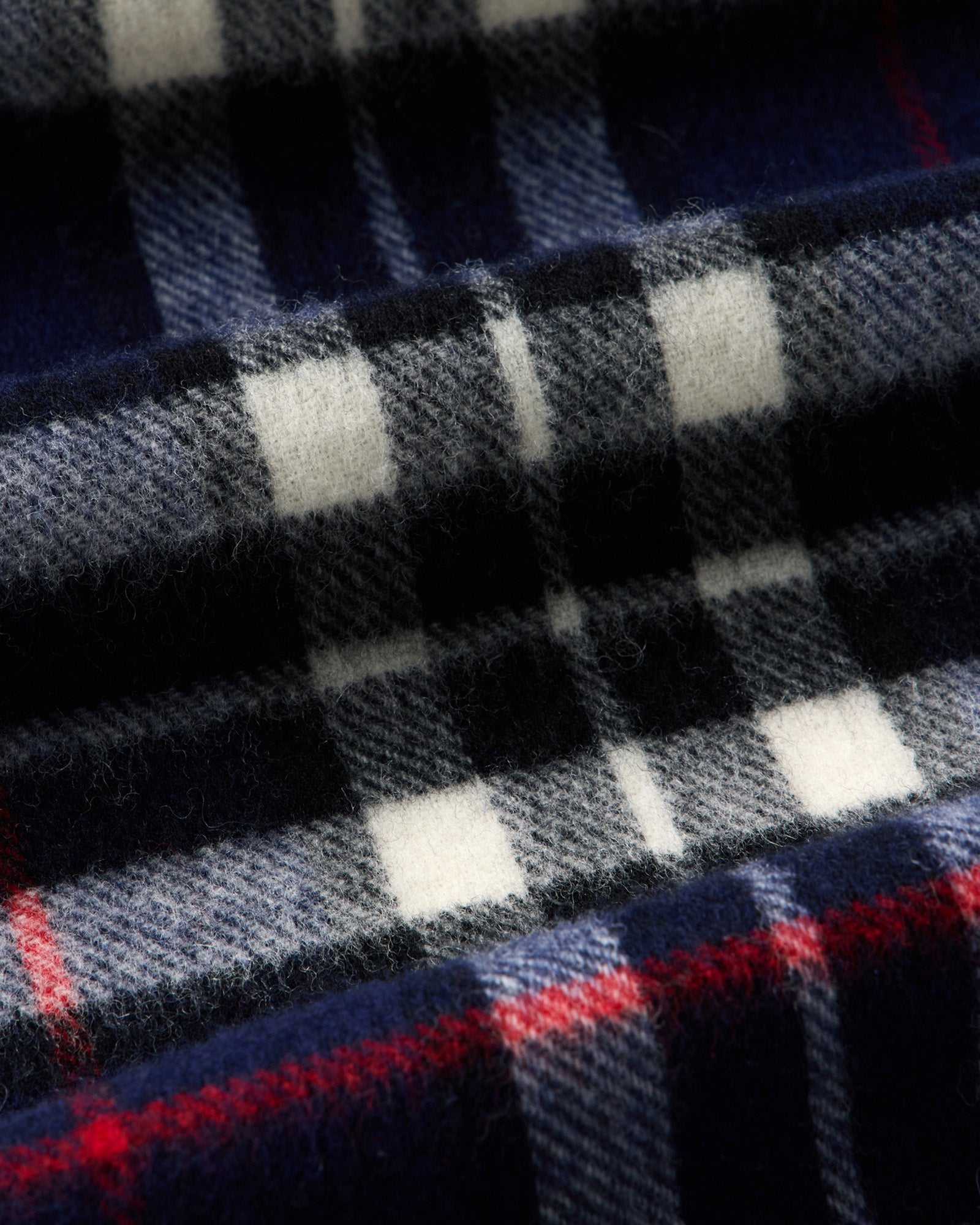 material shot of the fabric on The Fireside Scarf in Eddy Plaid, Accessories by Taylor Stitch