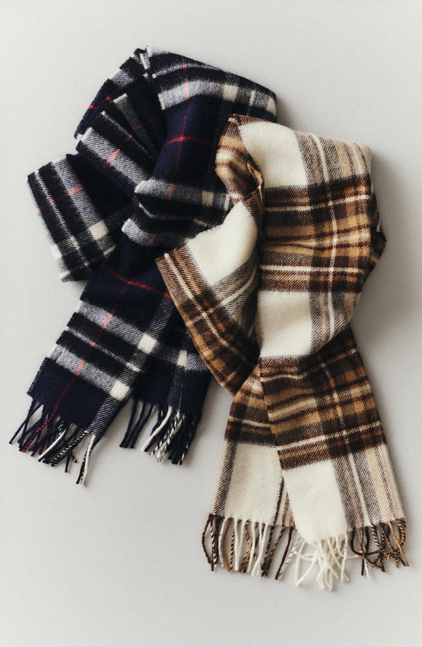 editorial flatlay of The Fireside Scarf in Eddy Plaid