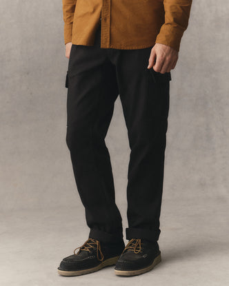 fit model showing off The Forest Cargo Pant in Coal Broken Twill