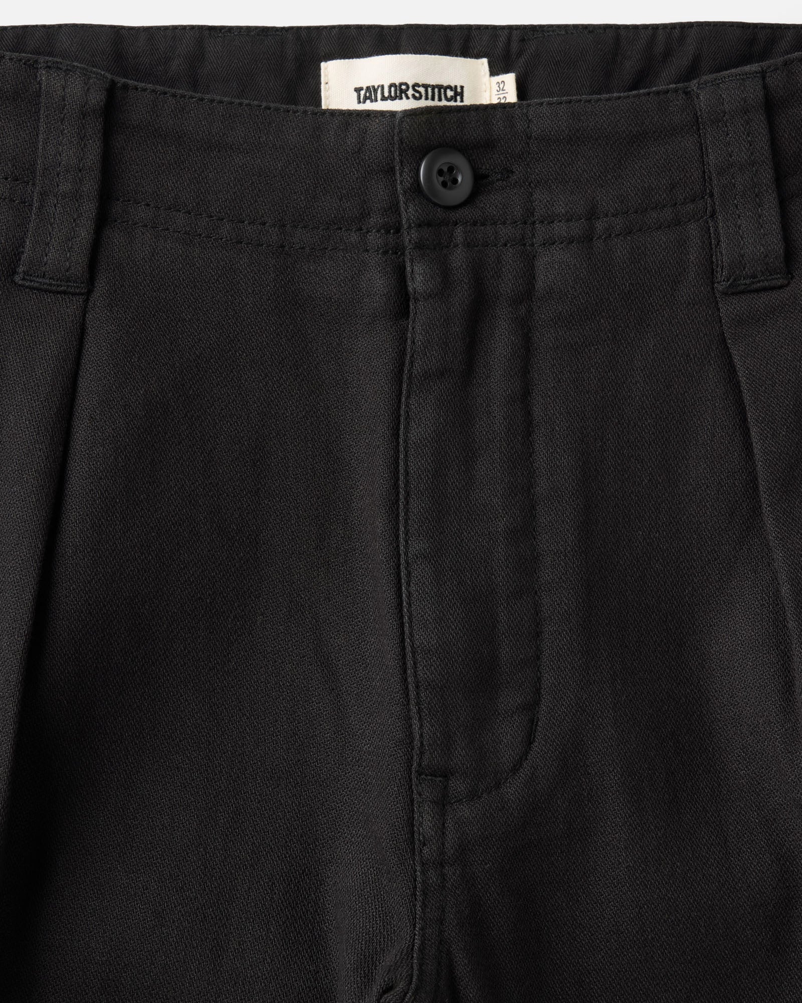 material shot of the waistband on The Forest Cargo Pant in Coal Broken Twill, Bottoms by Taylor Stitch