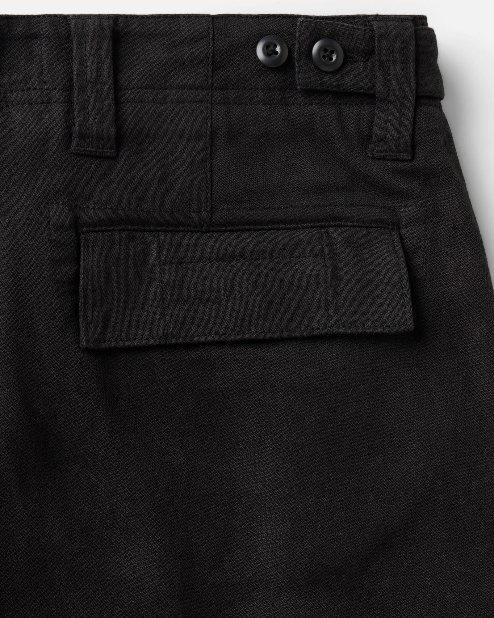 material shot of the back pocket on The Forest Cargo Pant in Coal Broken Twill, Bottoms by Taylor Stitch