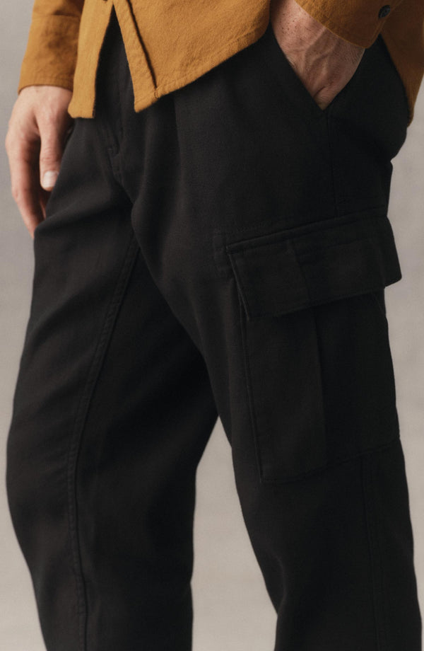 fit model showing off the pocket on The Forest Cargo Pant in Coal Broken Twill