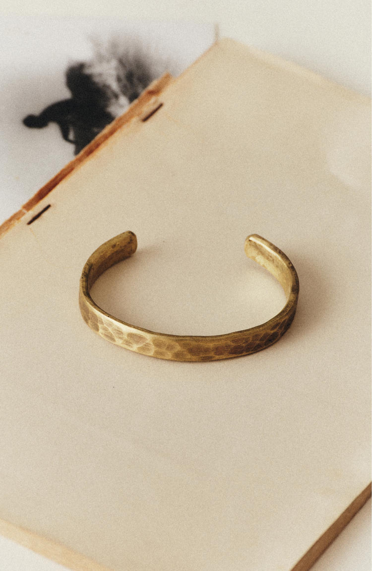editorial image of The Hammered Cuff in Brass on a block