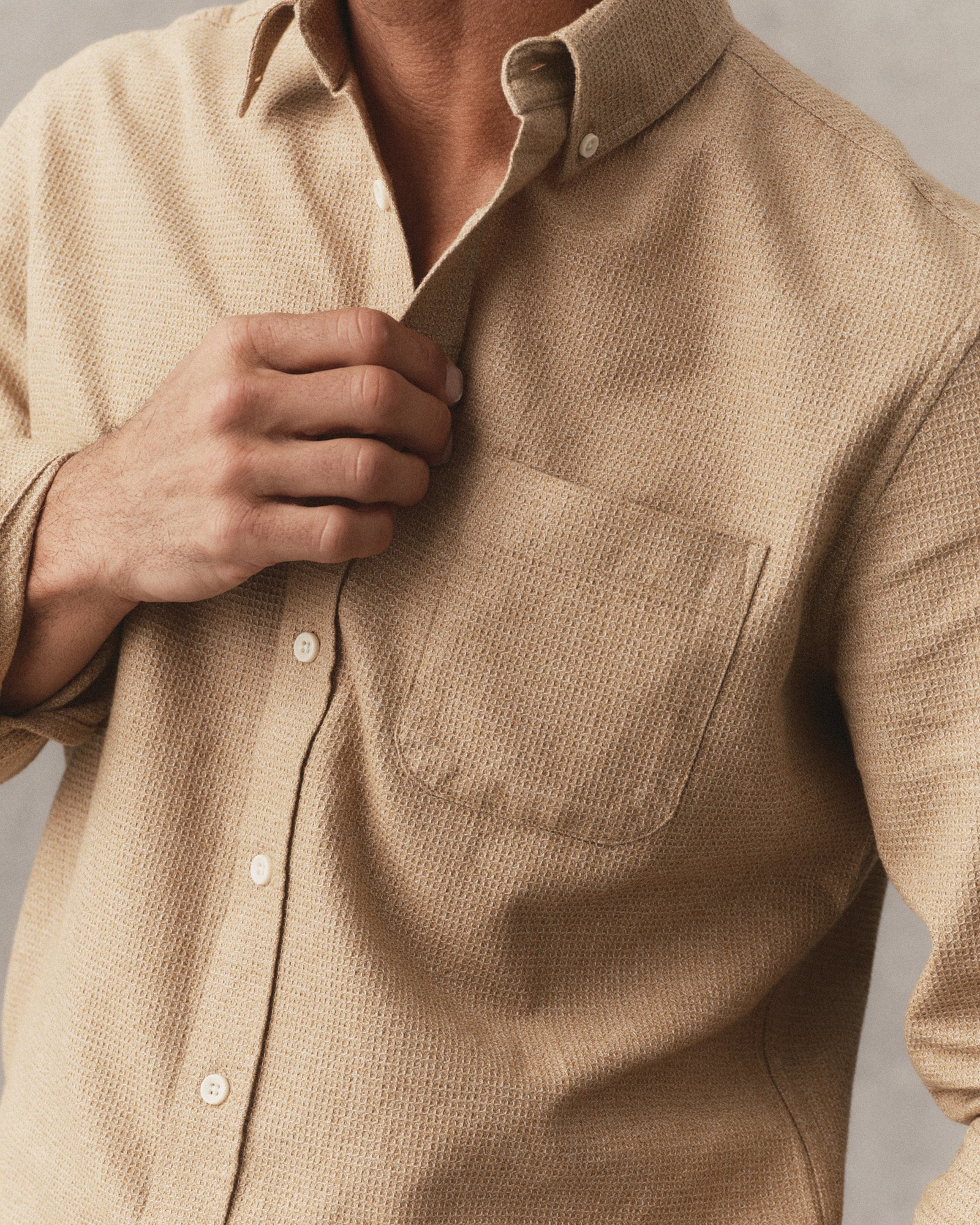 fit model showing off the buttons on The Jack in Saffron Waffle, Wovens by Taylor Stitch