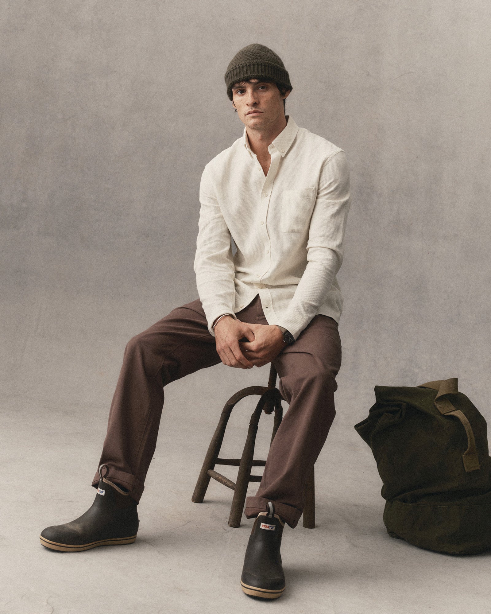 fit model sitting in The Jack in Vintage White Waffle, Wovens by Taylor Stitch