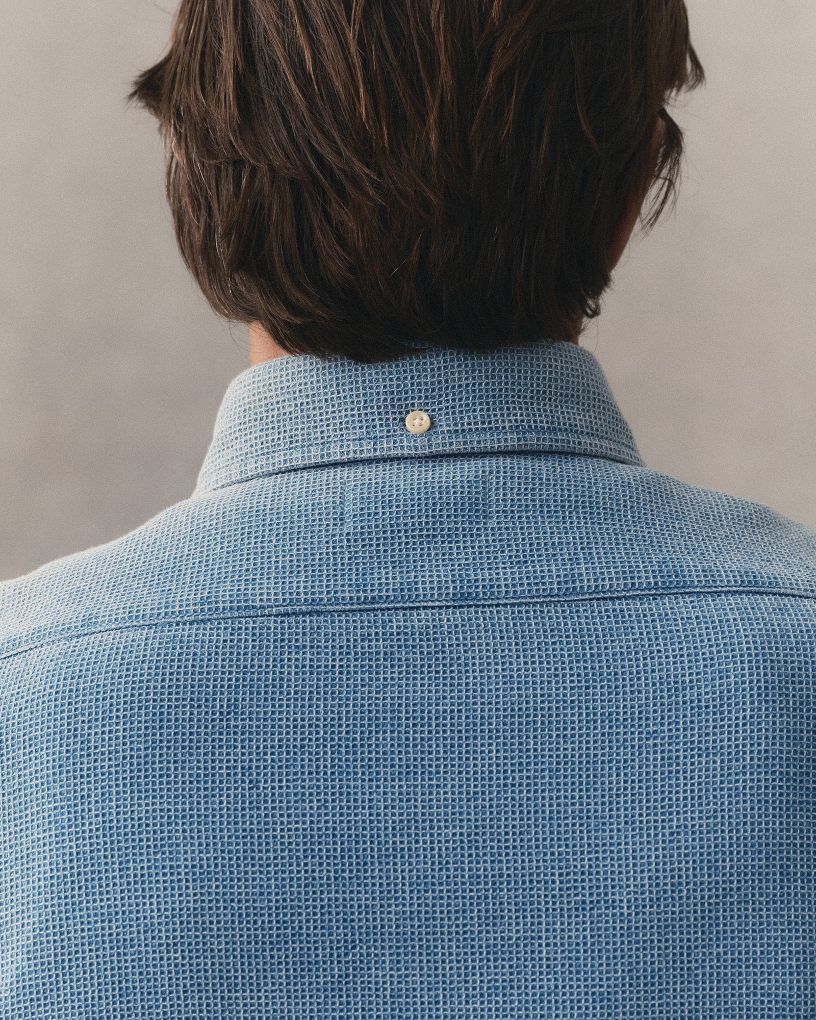 fit model showing the back of The Jack in Washed Indigo Waffle, Wovens by Taylor Stitch