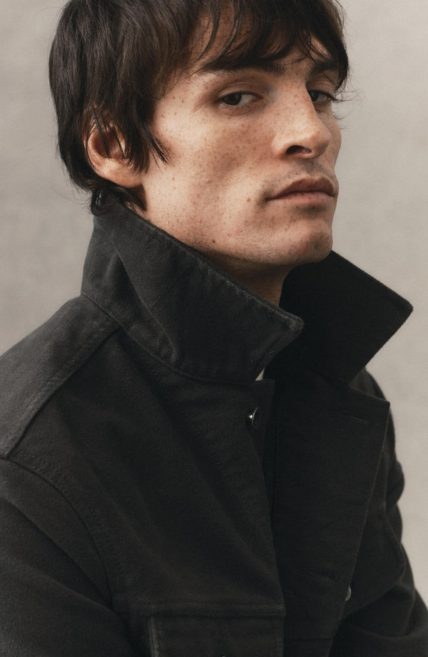 fit model showing off the collar on The Long Haul Jacket in Faded Black Washed Moleskin