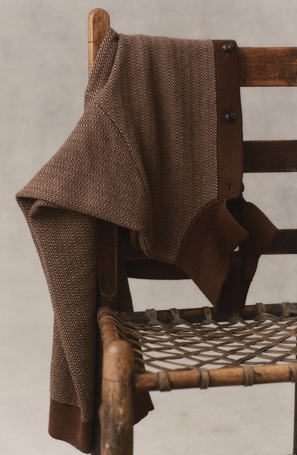 editorial image of The Miles Sweater Polo in Espresso Merino on a chair