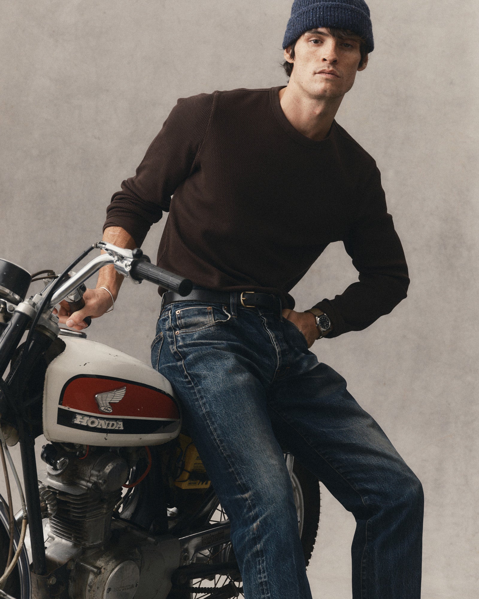 fit model sitting wearing The Organic Cotton Crew in Soil Waffle, Knits by Taylor Stitch