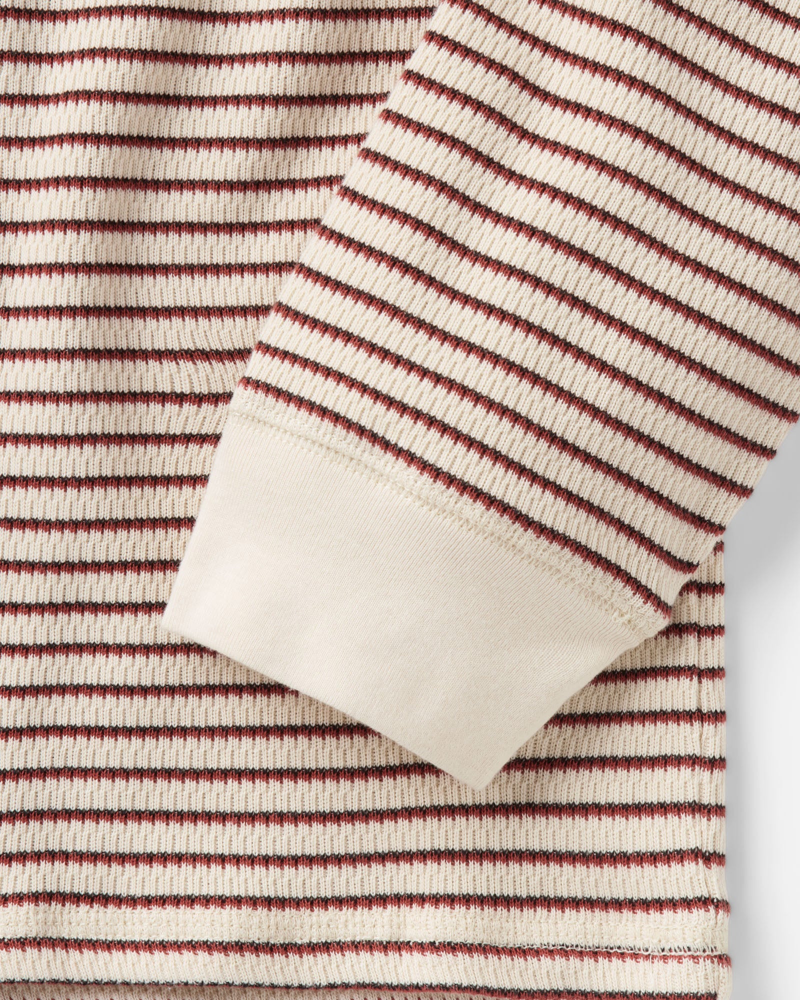 material shot of the sleeve on The Organic Cotton Crew in Vintage White Stripe Waffle, Knits by Taylor Stitch