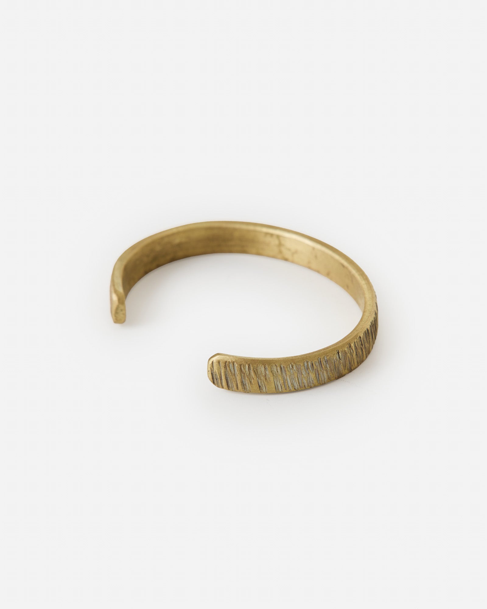 editorial image of the side of The Rough Cuff in Brass, Accessories by Taylor Stitch