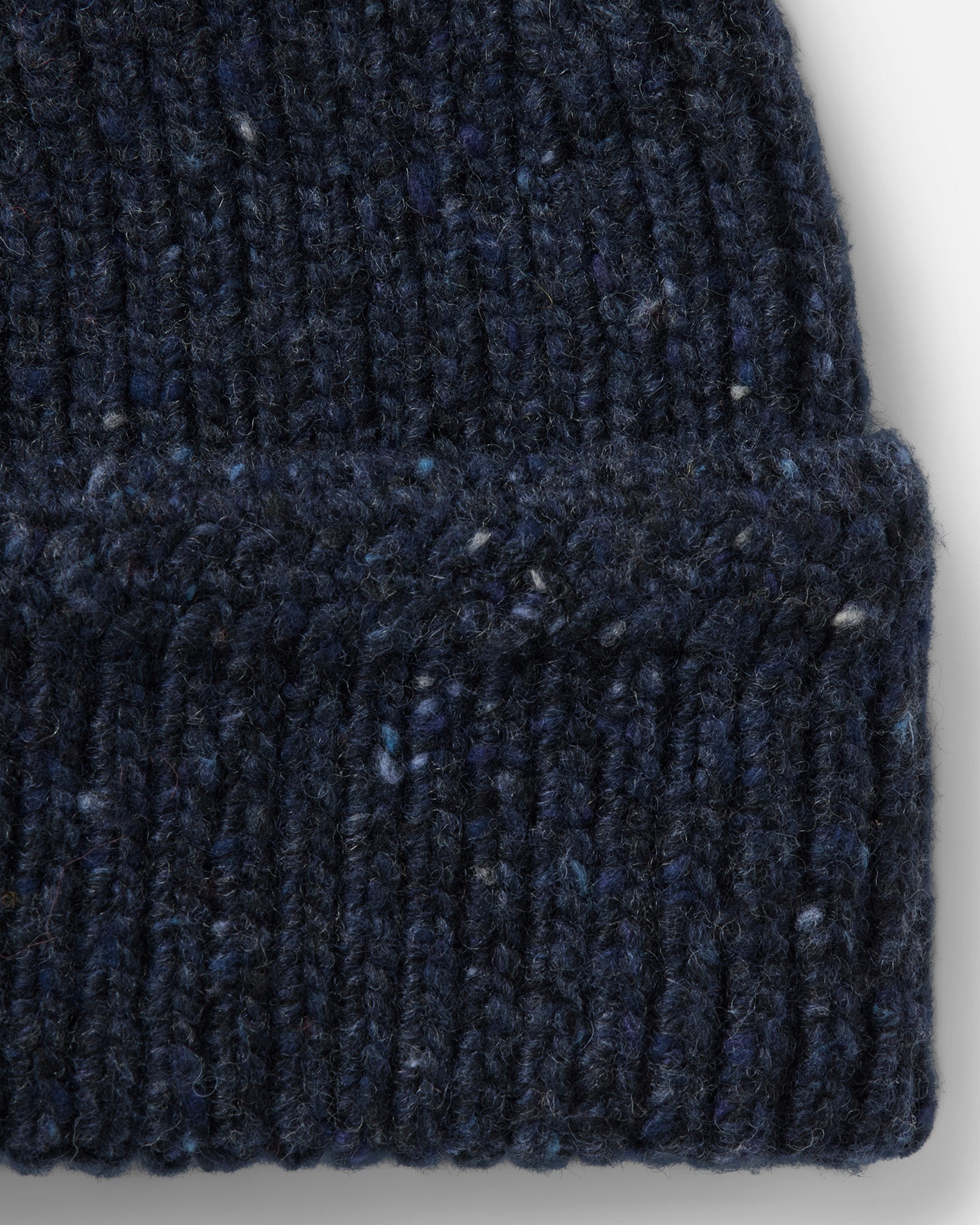 material shot of the side of The Seafarer Beanie in Atlantic Blue Donegal, Accessories by Taylor Stitch