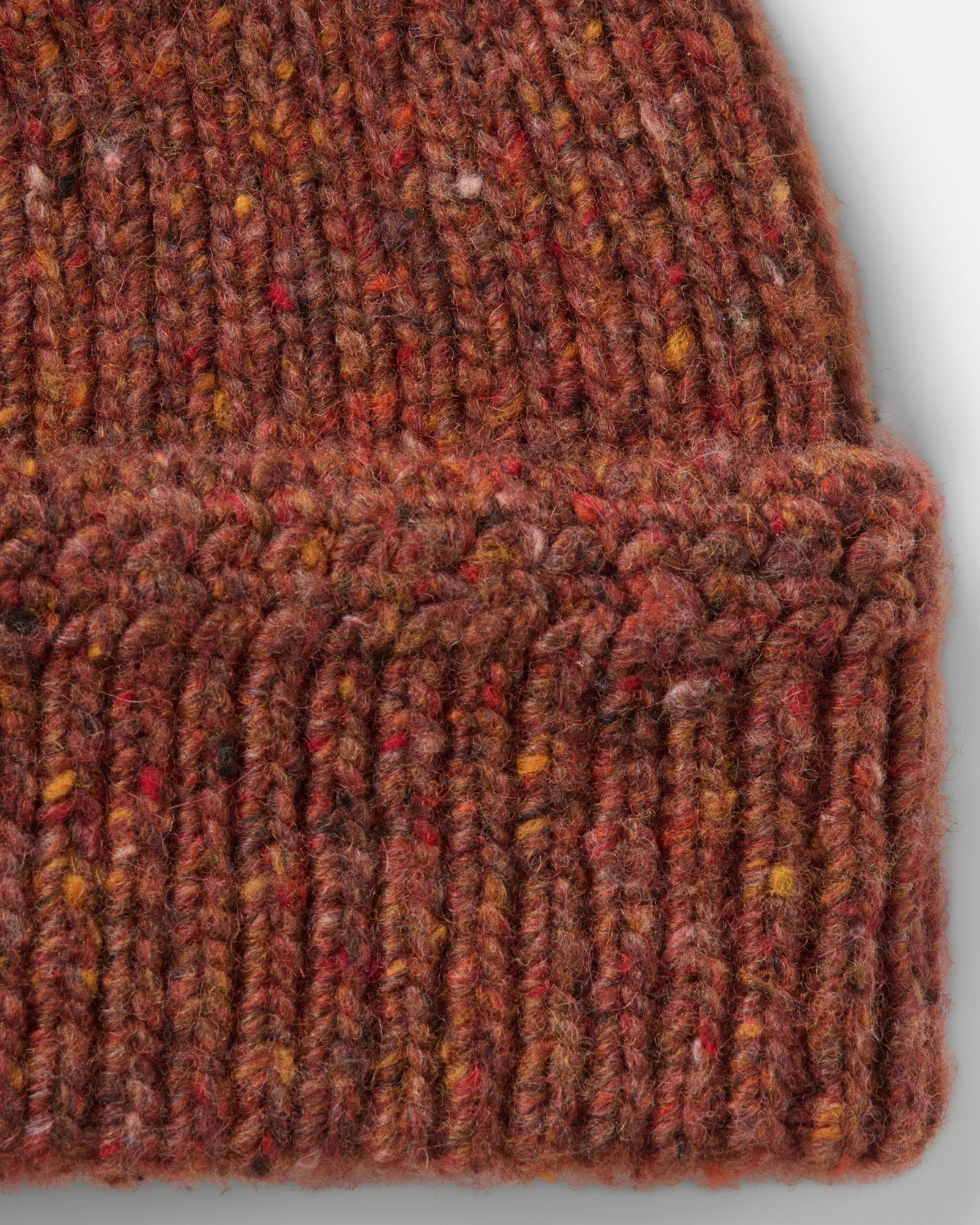material shot of the side of The Seafarer Beanie in Ember Donegal, Accessories by Taylor Stitch