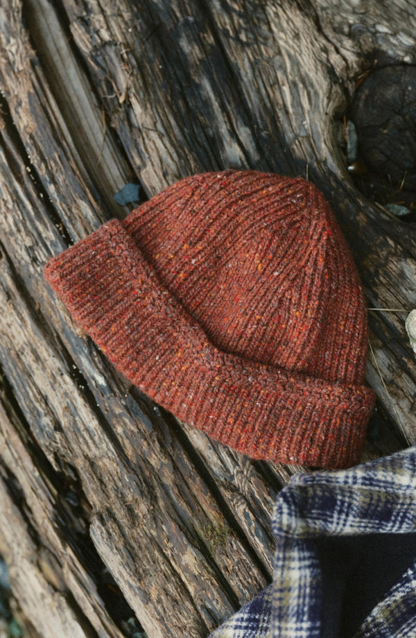 editorial flatlay of The Seafarer Beanie in Ember Donegal