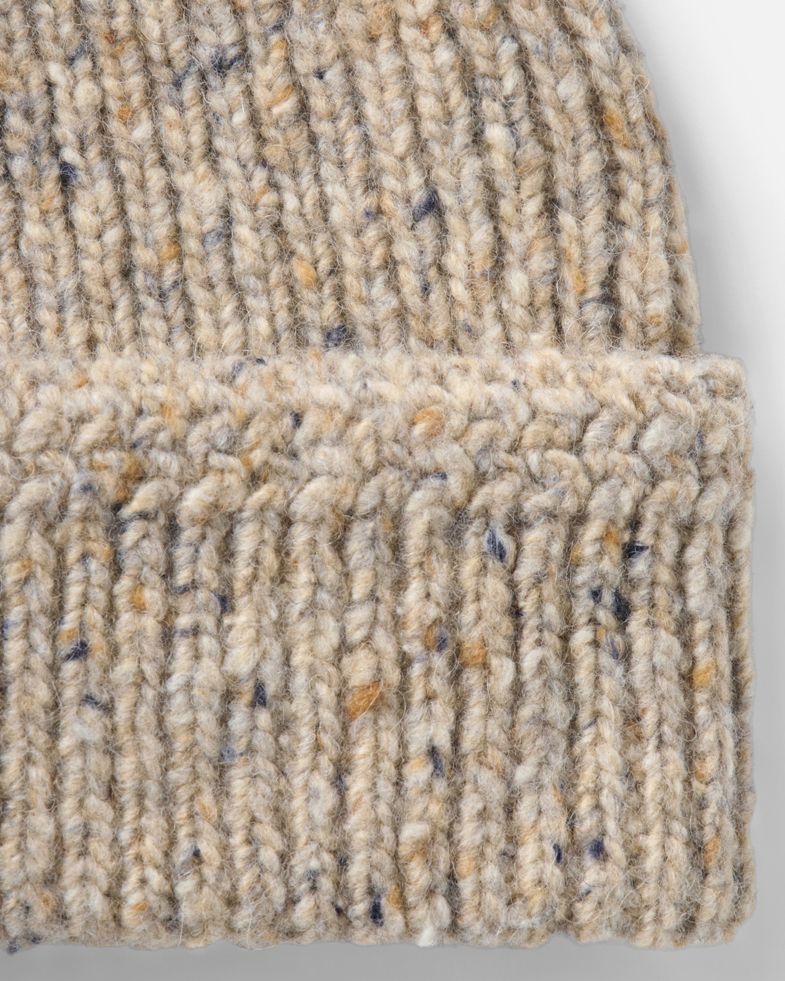 material shot of the side of The Seafarer Beanie in Natural Donegal, Accessories by Taylor Stitch