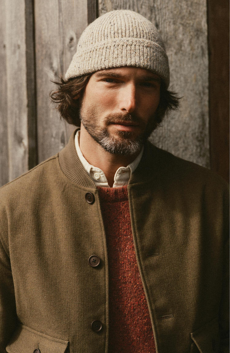 fit model posing in The Seafarer Beanie in Natural Donegal
